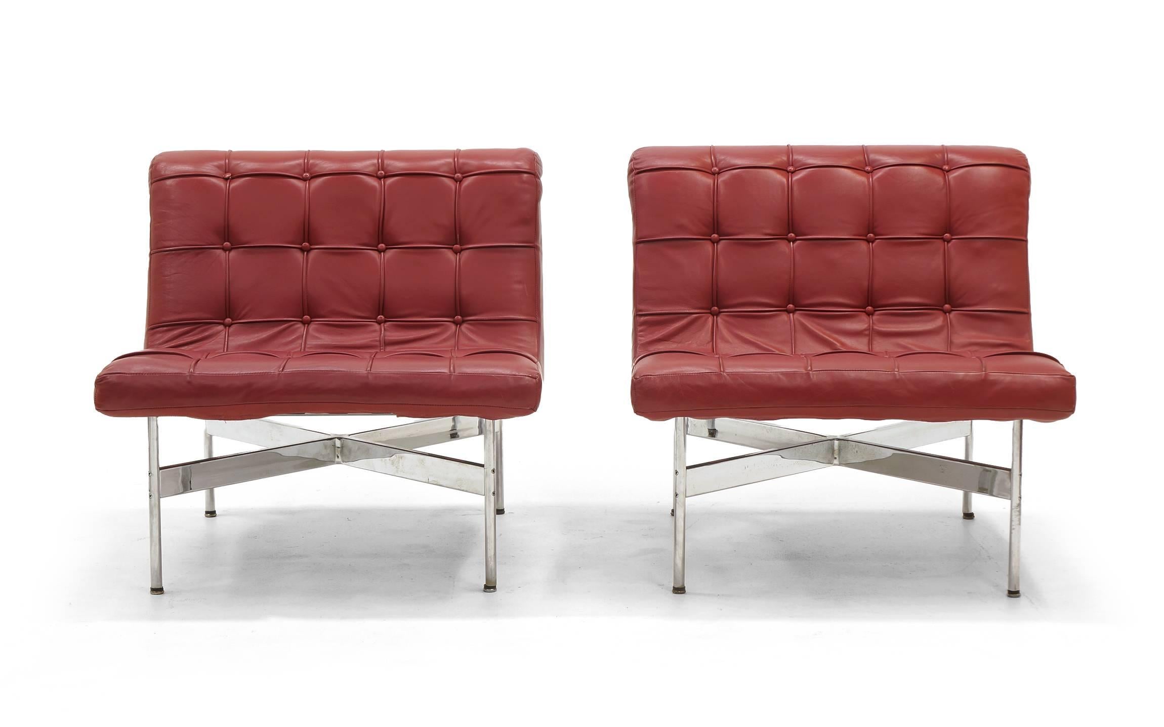 A pair of lounge chairs from the Architectural Group one line designed by William Katavolos, Ross Littell and Douglas Kelley for Laverne International. Original deep red color leather. Beautiful pair.