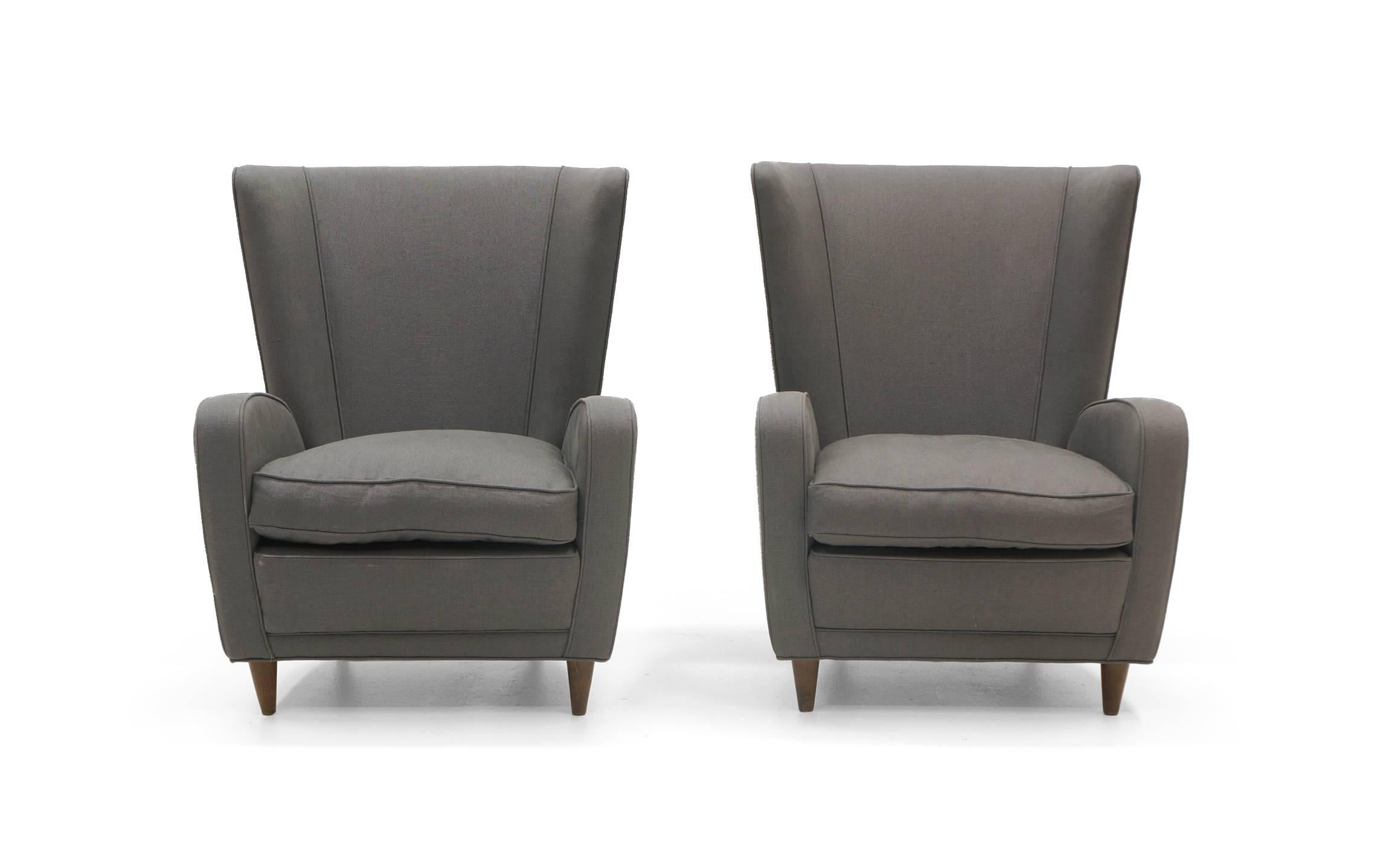 Pair of lounge chairs designed by Paolo Buffa for the Hotel Bristol, Merano, Italy, circa 1950. Expertly restored and reupholstered in a charcoal / grey fabric.