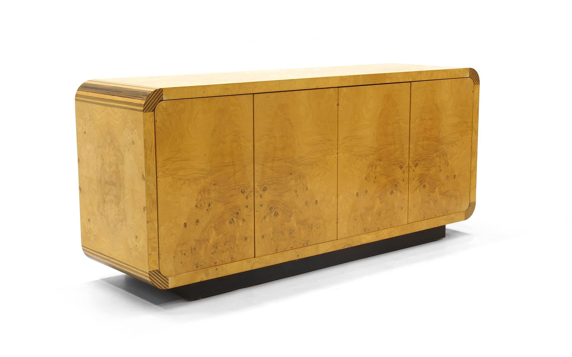 Henredon scene two storage cabinet in honey colored burl with ebony accents on the curved corners. Beautiful.