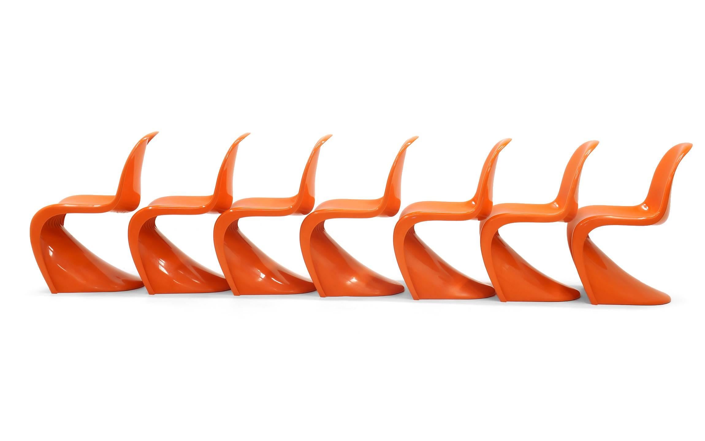 Three available.  The earliest version of the Iconic S chair in orange designed by Verner Panton, made by Vitra and sold by Herman Miller.  Each chair is embossed with the Herman Miller Logo.  This is the first all plastic chair ever produced.