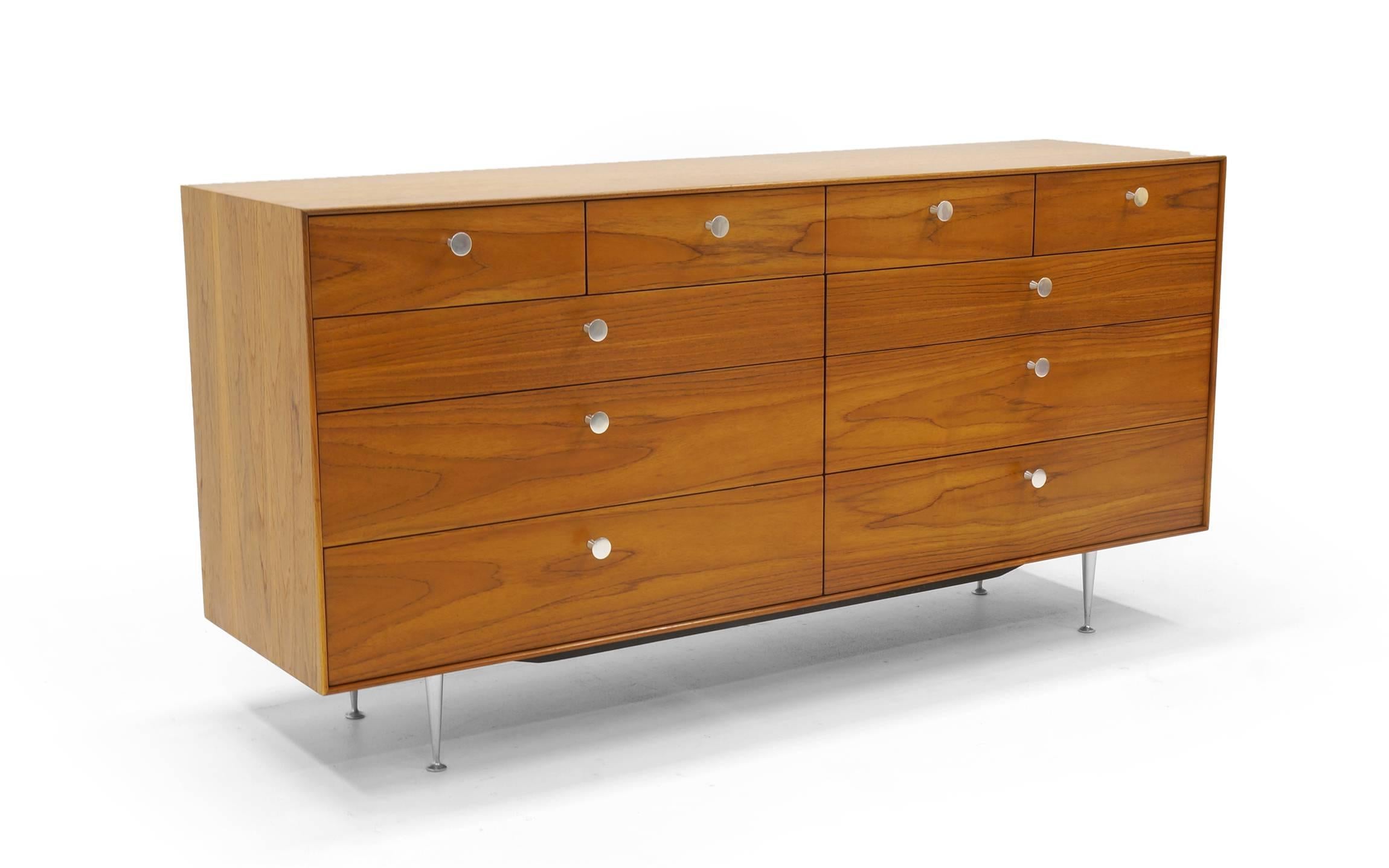 Exceptional and rare version of the George Nelson for Herman Miller thin edge cabinet for Herman Miller. Walnut case with cast aluminium pulls and legs. Ten drawers. Expertly and thoughtfully restored and refinished.