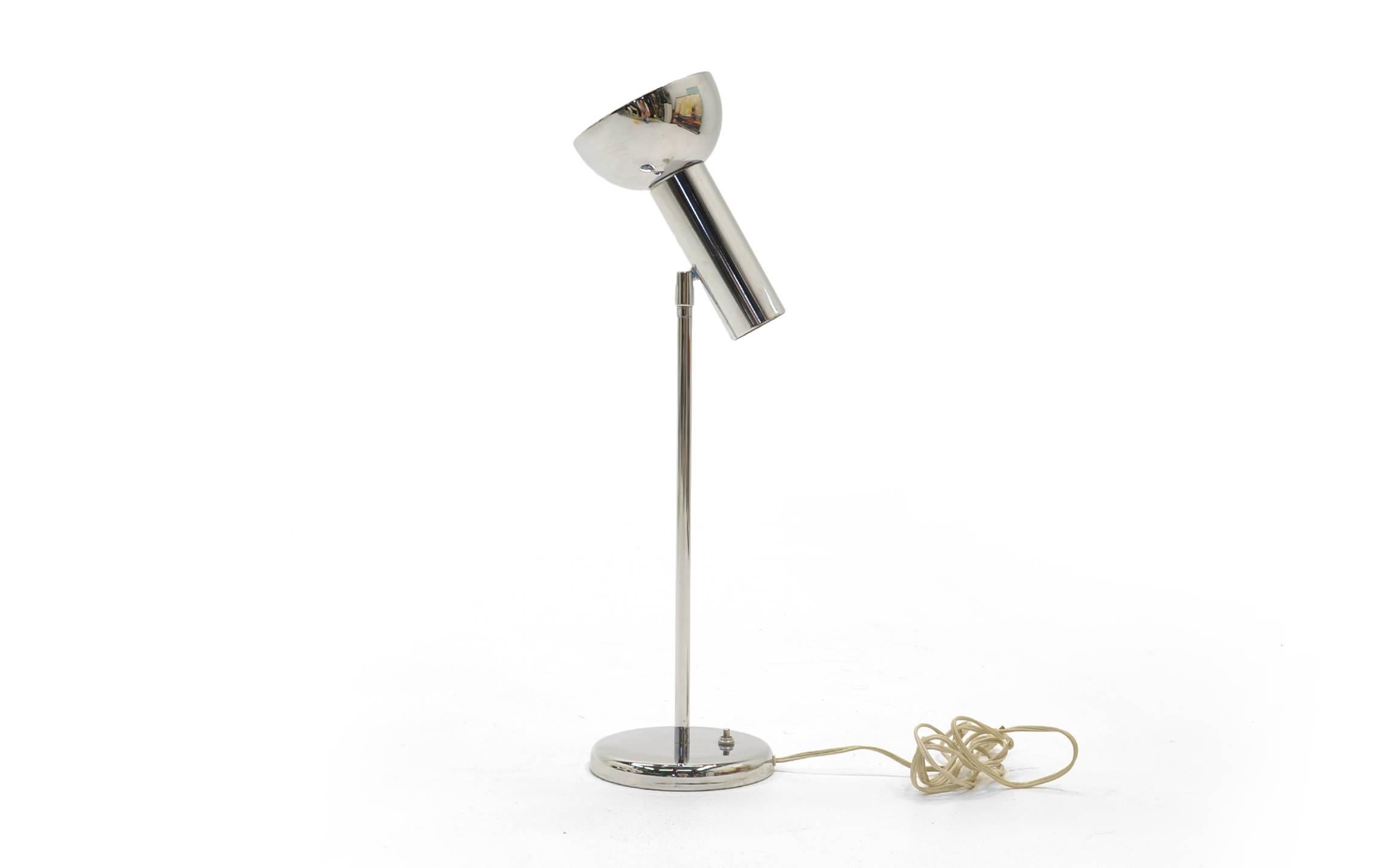 Adjustable table lamp designed by George Kovacs in polished chromed steel. Perfect as a reading lamp or accent lamp.