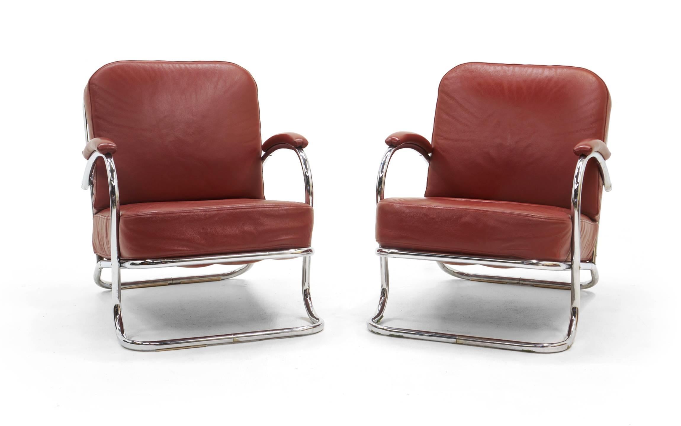 KEM Weber Art Deco / Machine Age lounge chairs. Tubular chrome frames and reupholstered in red leather. Beautiful pair.