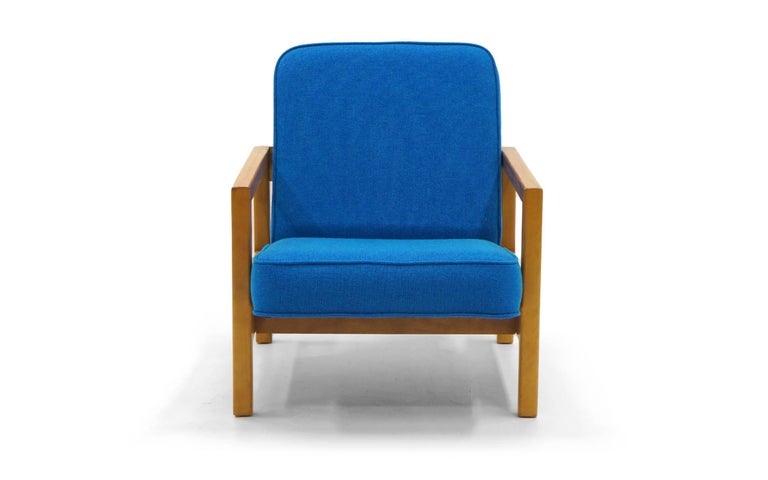 George Nelson armchair in new blue Maharam fabric. Blonde Primavera frame in excellent condition.