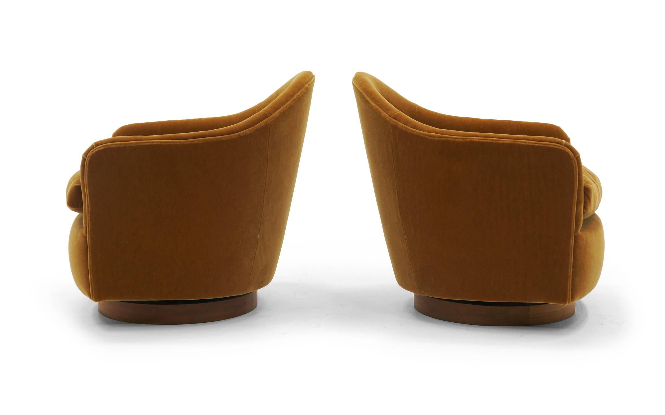 Mid-Century Modern Pair of Tilt and Swivel Barrel Chairs by Milo Baughman.  Caramel color Mohair.