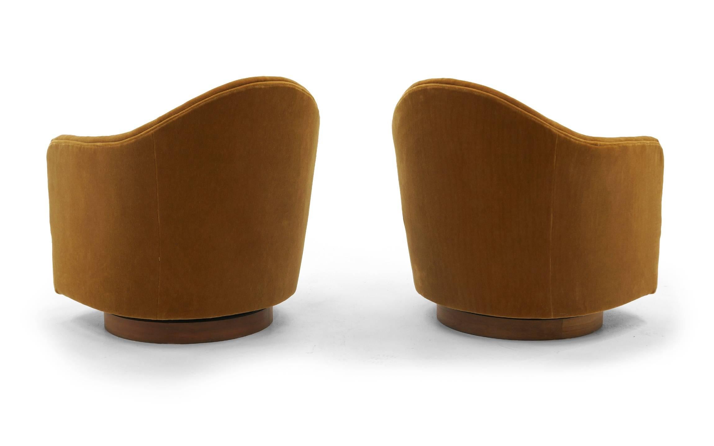 American Pair of Tilt and Swivel Barrel Chairs by Milo Baughman.  Caramel color Mohair.