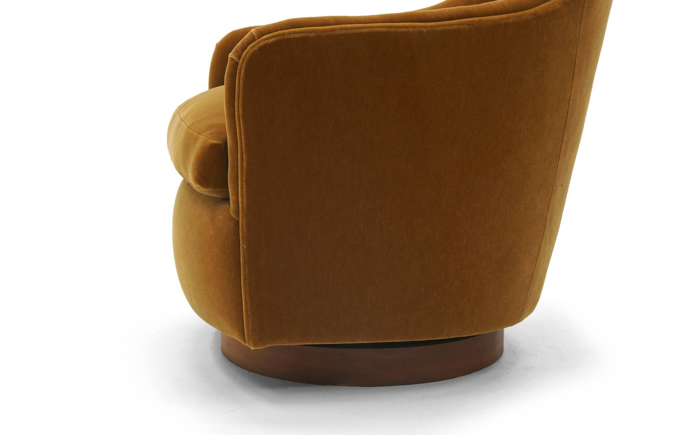 Mid-20th Century Pair of Tilt and Swivel Barrel Chairs by Milo Baughman.  Caramel color Mohair.