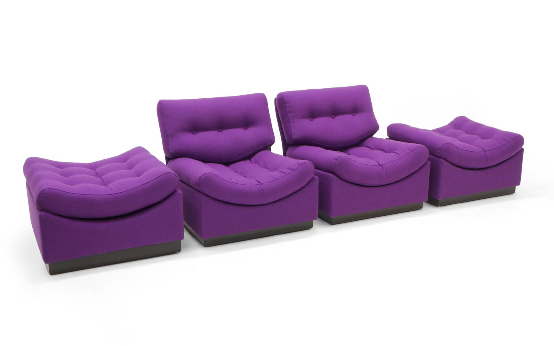 Pair of low chairs with ottomans /  floor chaises completely restored and upholstered in a purple / plum / violet Maharam Hallingdale fabric by Nana Ditzl.  These modular armless chairs and ottomans can also be arranged as a sofa. They look awesome