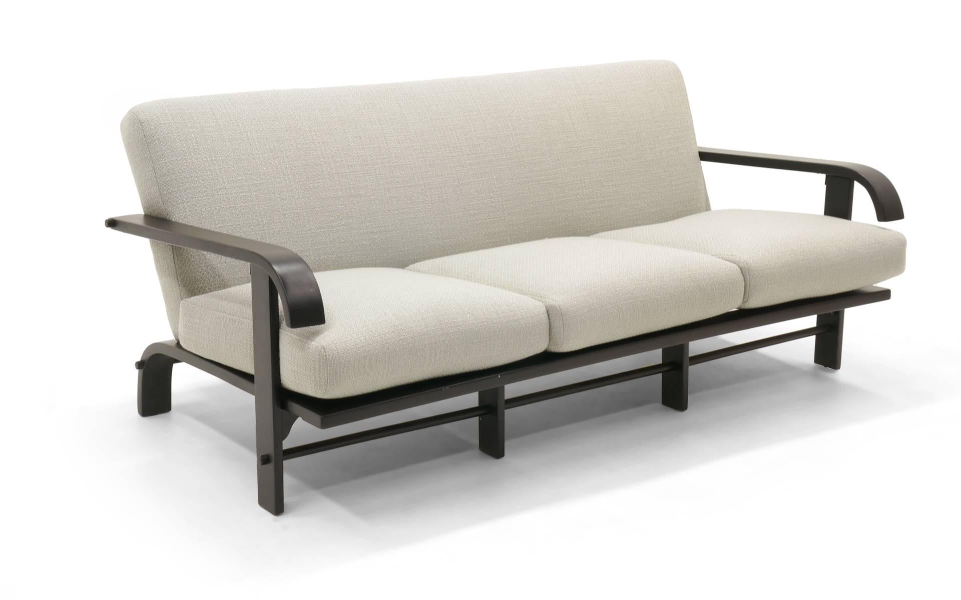 Russel Wright for Conant Ball sofa. Black lacquered wood frame and newly upholstered in a beautiful light grey or sliver fabric.