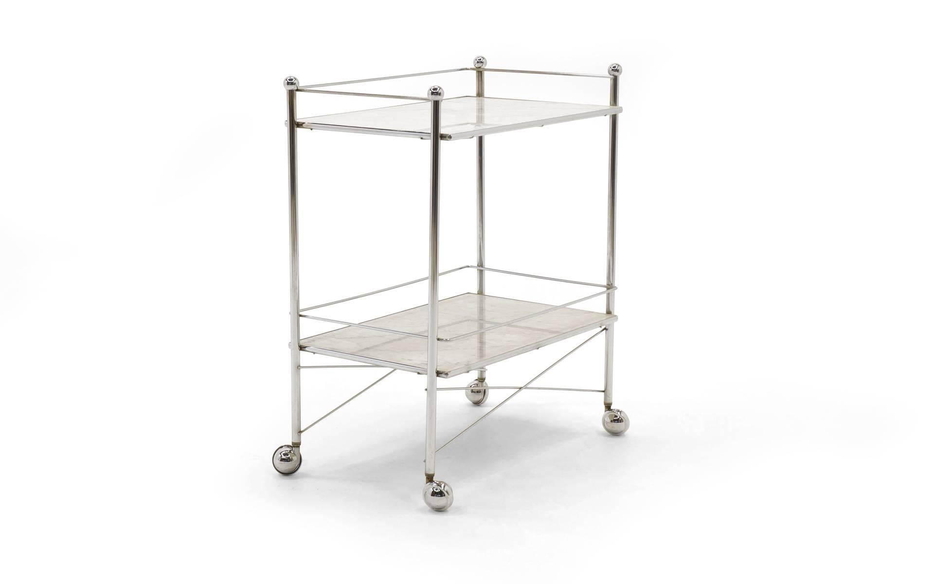 Simple, elegant serving cart. Chromed steel frame on the original chrome casters and white Italian marble shelves.  Great scale for the dining room or kitchen