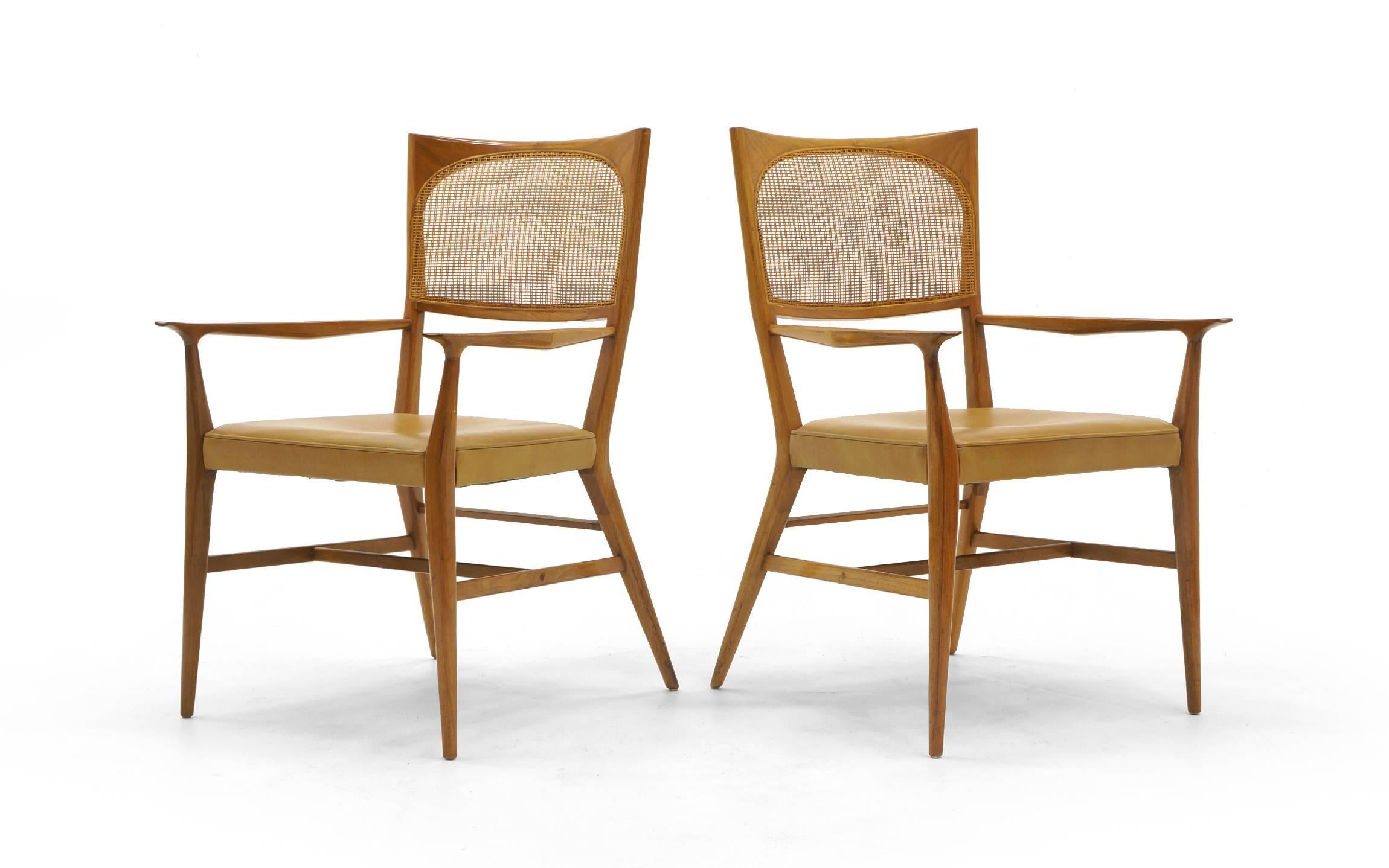 Pair of Paul McCobb for H. Sacks & Sons, Marlboro dining chairs from the New England Collection, Brookline, MA, USA, 1960s, each signed with Sacks label,  All original fruitwood frames, leather seats and cane backs in excellent condition.