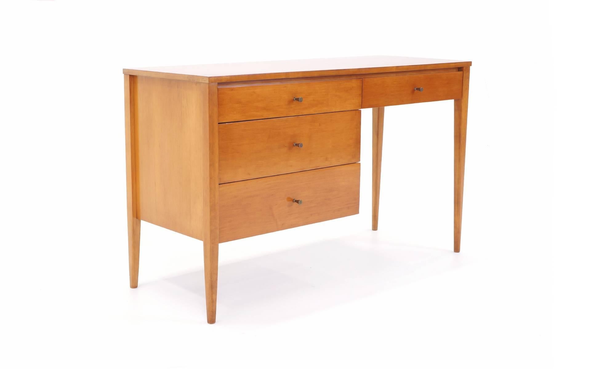 Excellent smaller scale Paul McCobb desk with the original pulls and in excellent condition.