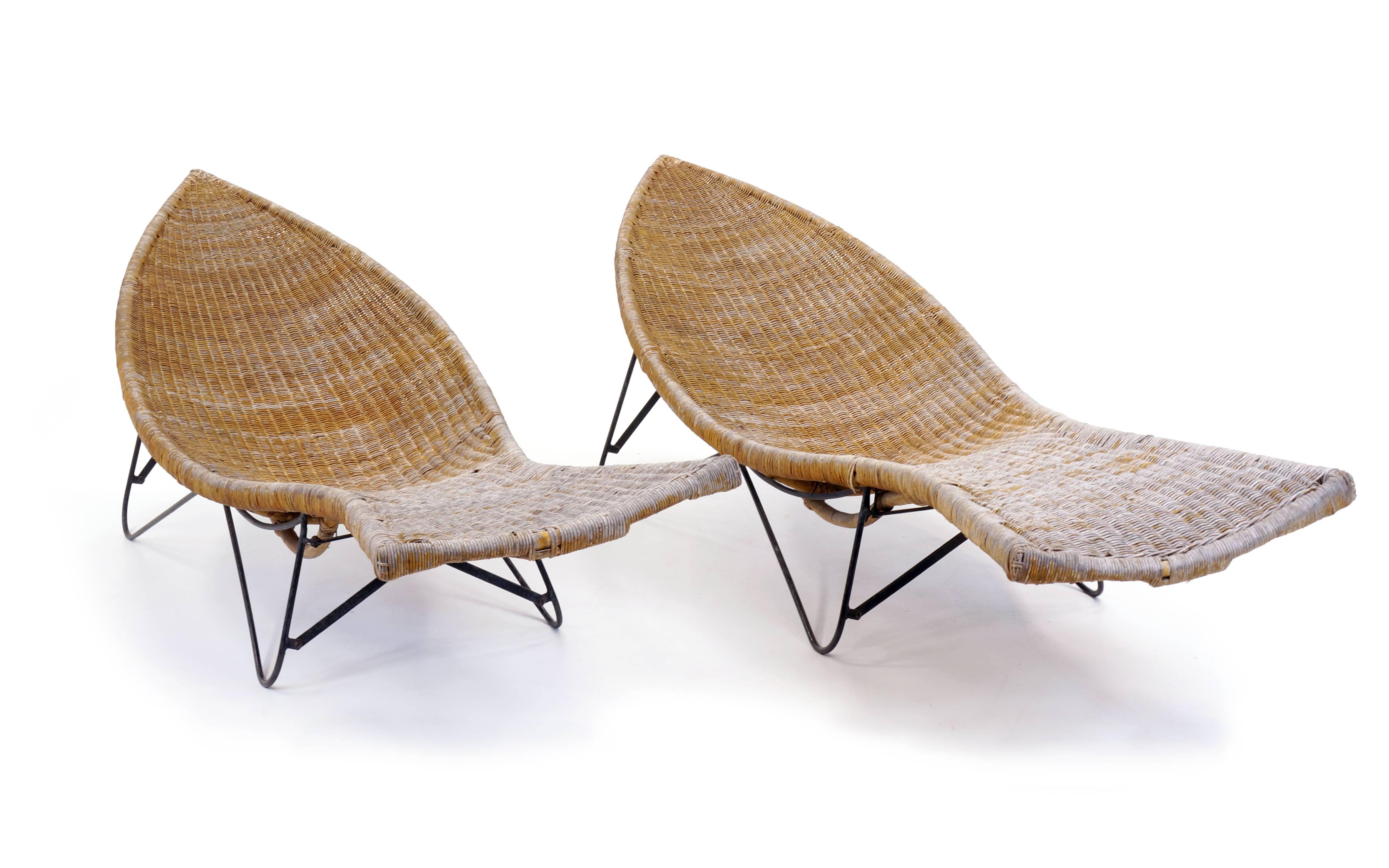 Awesome, large-scale pair of 1950s pool side chaises. The designer is unknown to us, but these are special. High quality construction and structurally sound. Some wear and weathering to the woven wicker as seen in the photos.