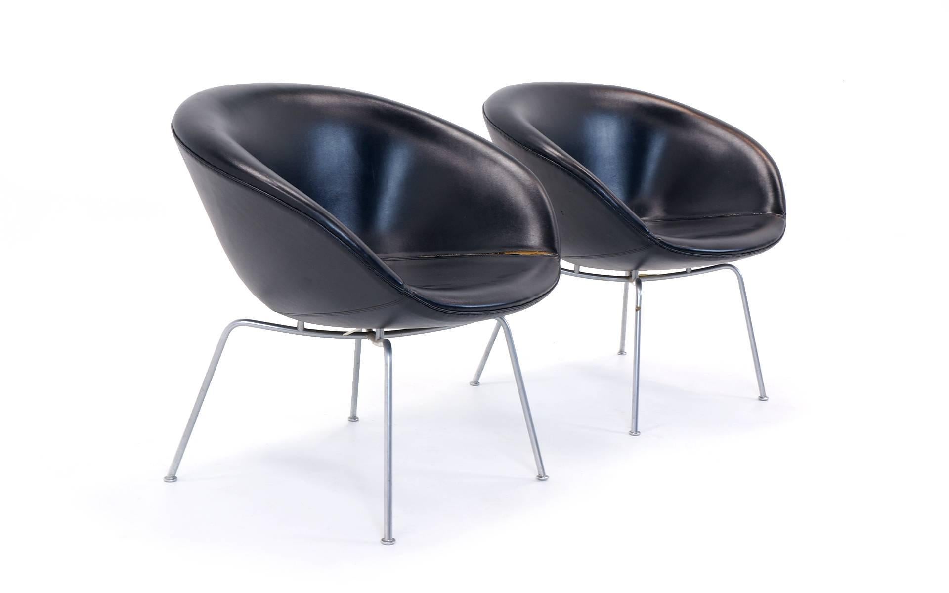 Pair of Pot chairs by Arne Jocobsen retaining their original Naugahyde upholstery.