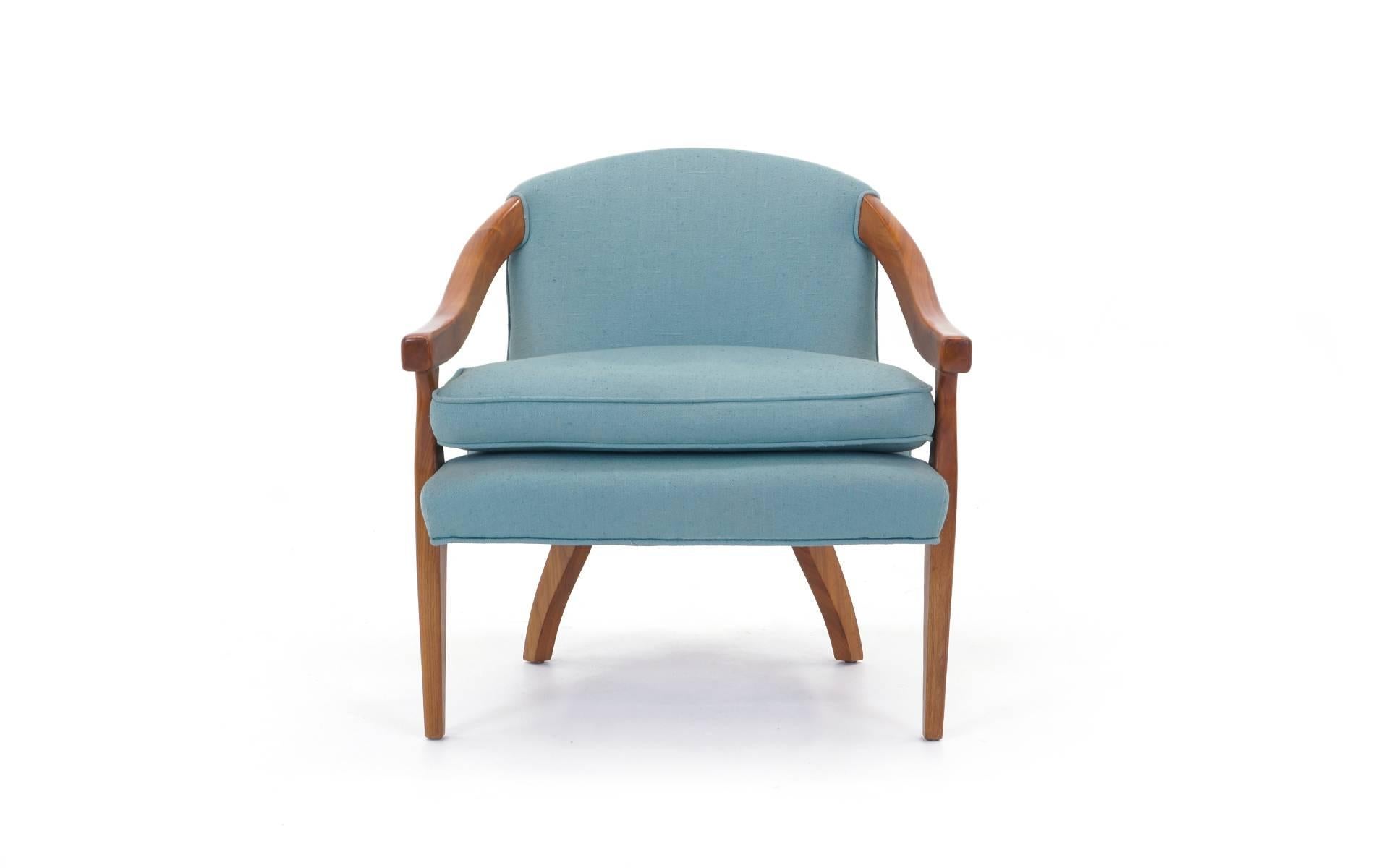 Stylish occasional chair in light blue fabric and walnut frame. Manufactured by Baker.