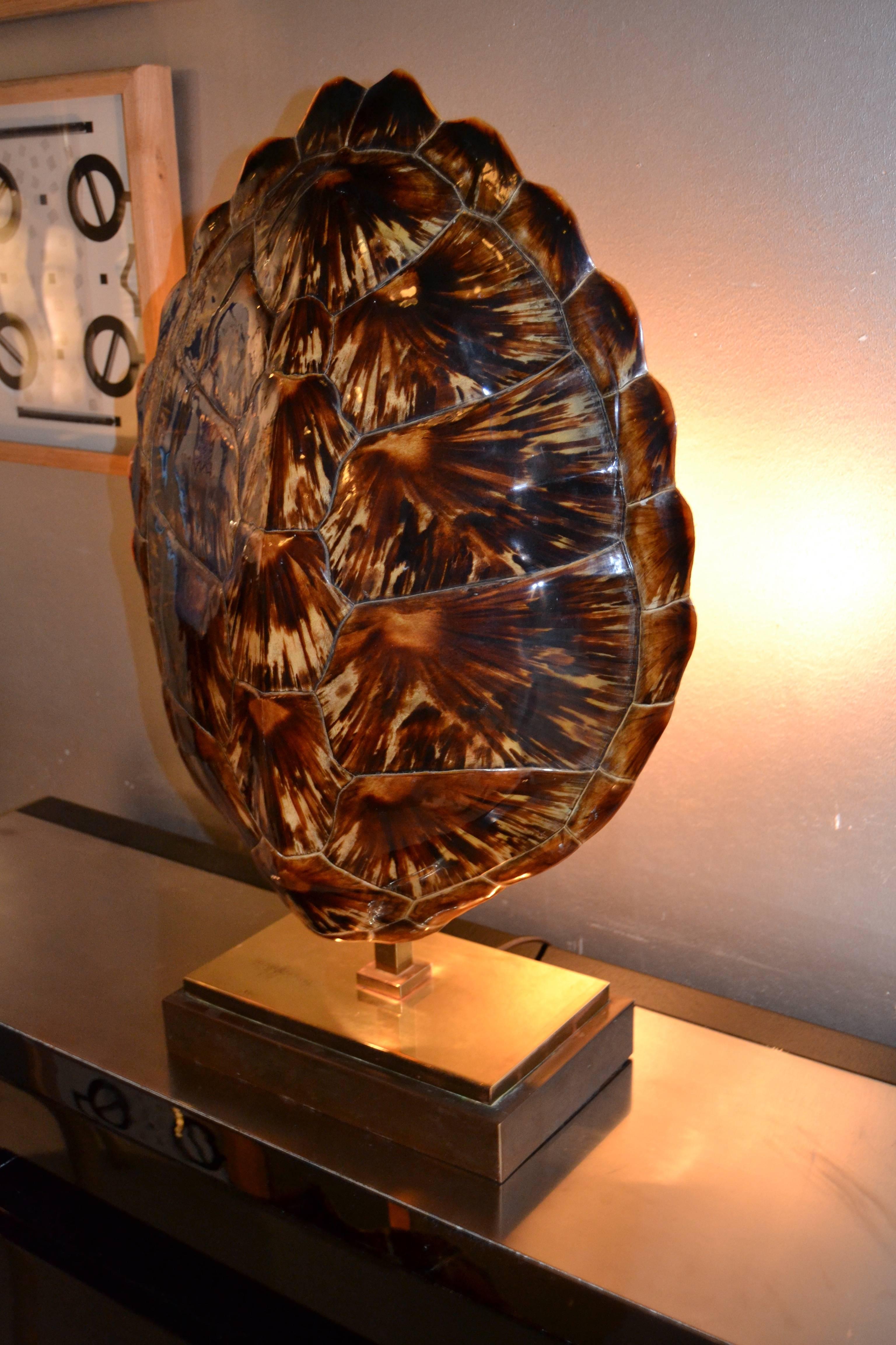 1970s tortoise shell mounted on brass and bronze lamp probably by Maison Jansen. Great vintage original condition.
Lamp has two bulbs that creates a great ambiance.