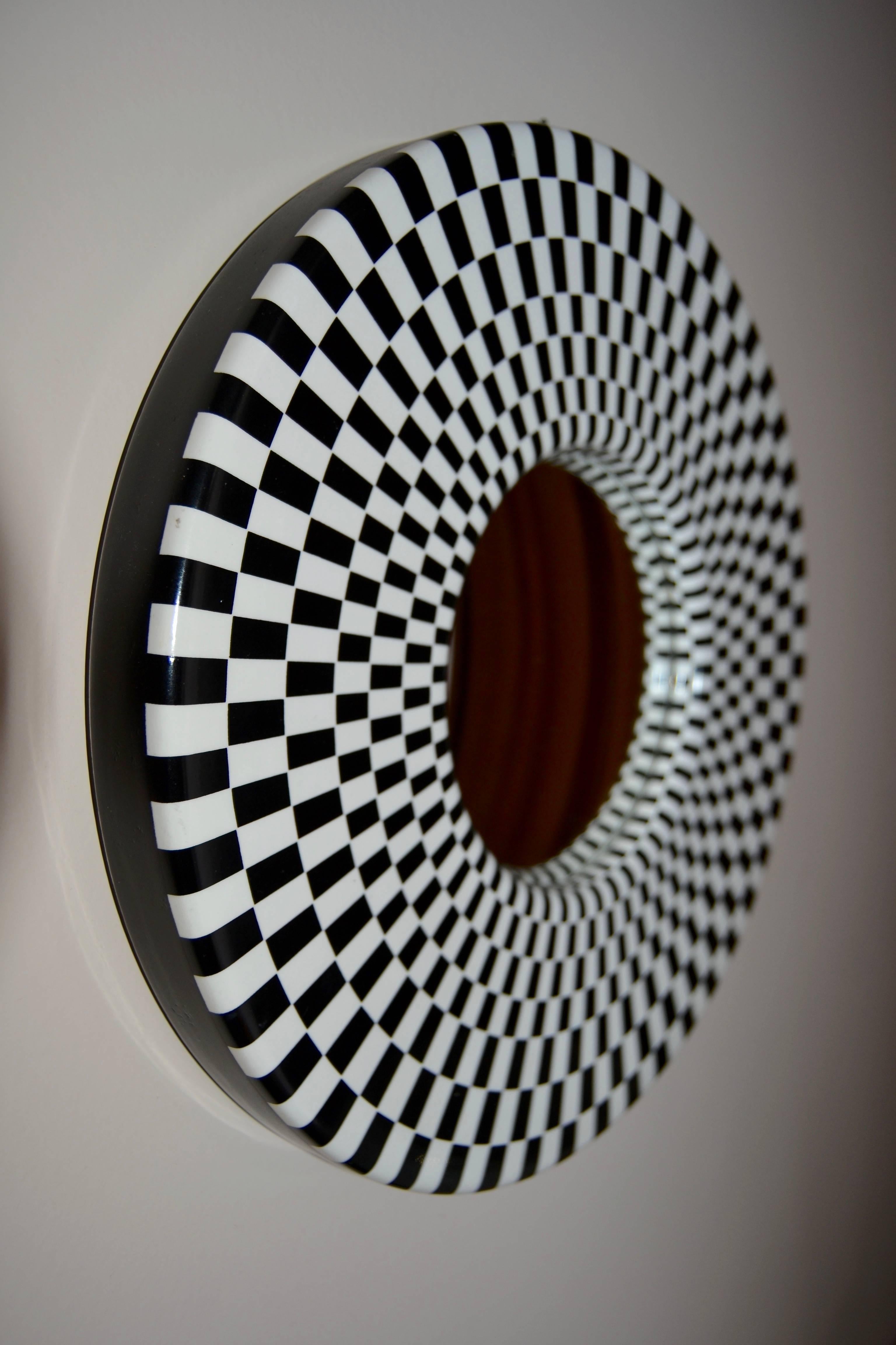 Fornasetti convex mirror with black and white pattern; signed Fornasetti Milano n1-2003.
Great condition.