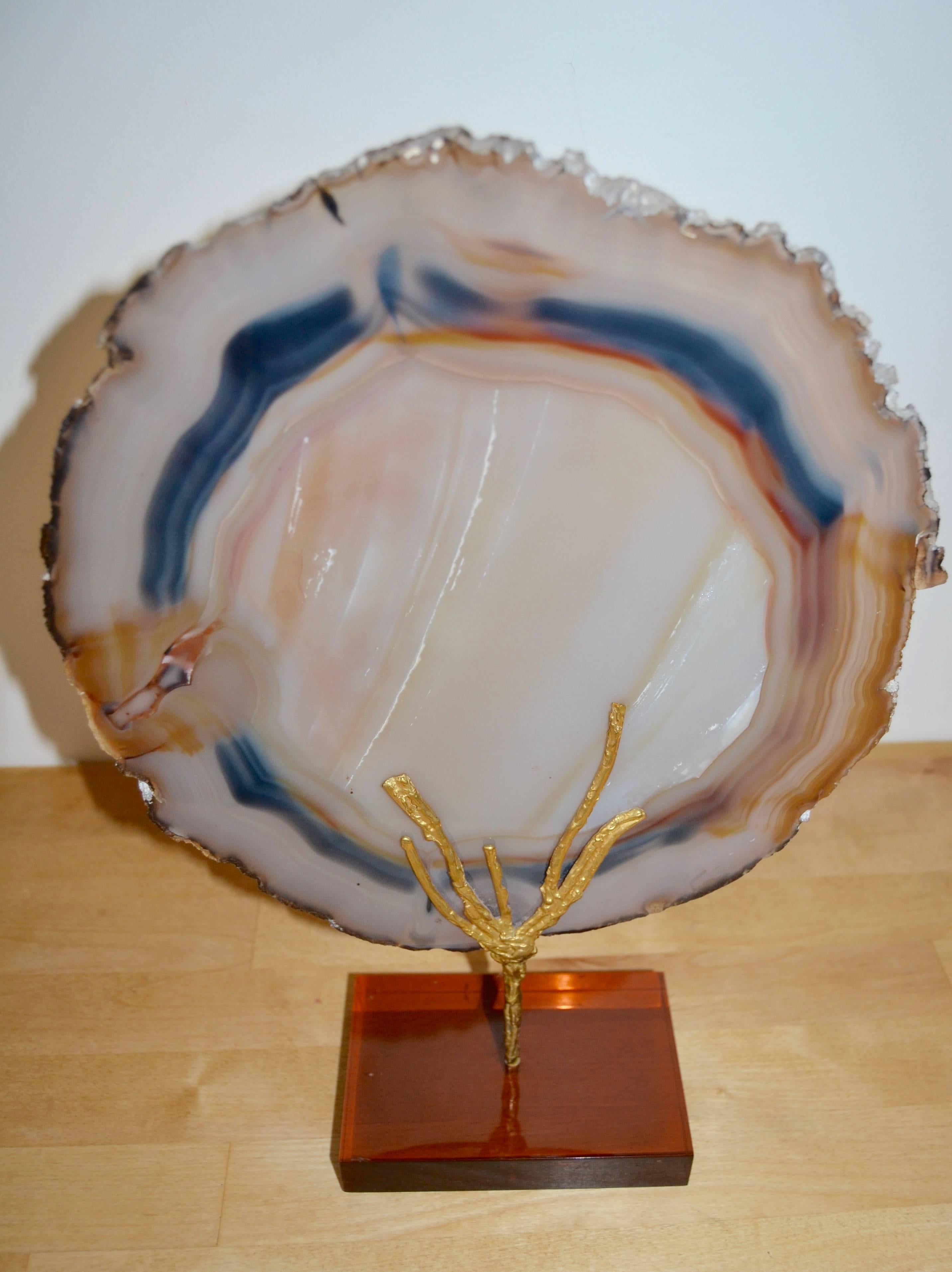 1970s mounted agate slice on bronze and smoked Lucite base.
Great vintage condition.