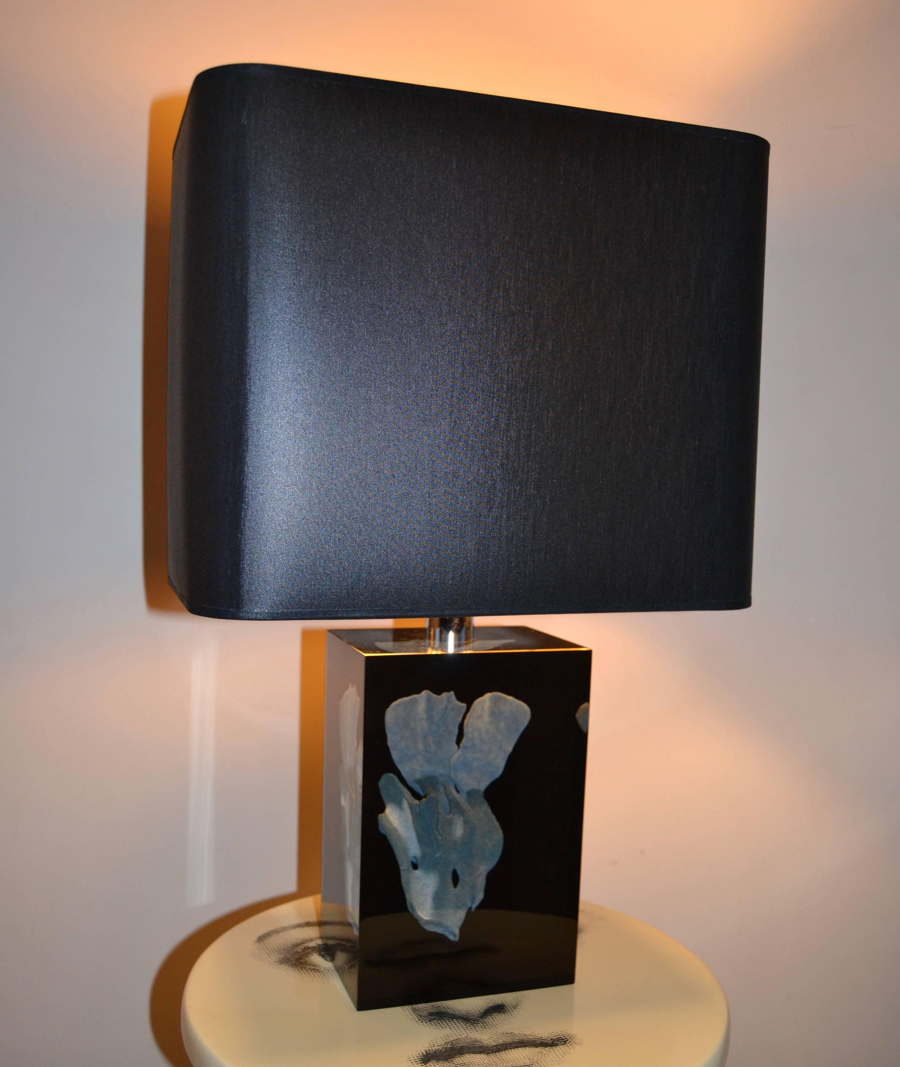 1970s clear Lucite with Inlaid bleu coral specimen table lamp;
Rewired with new shade in black and gold interior.
Great Vintage condition.