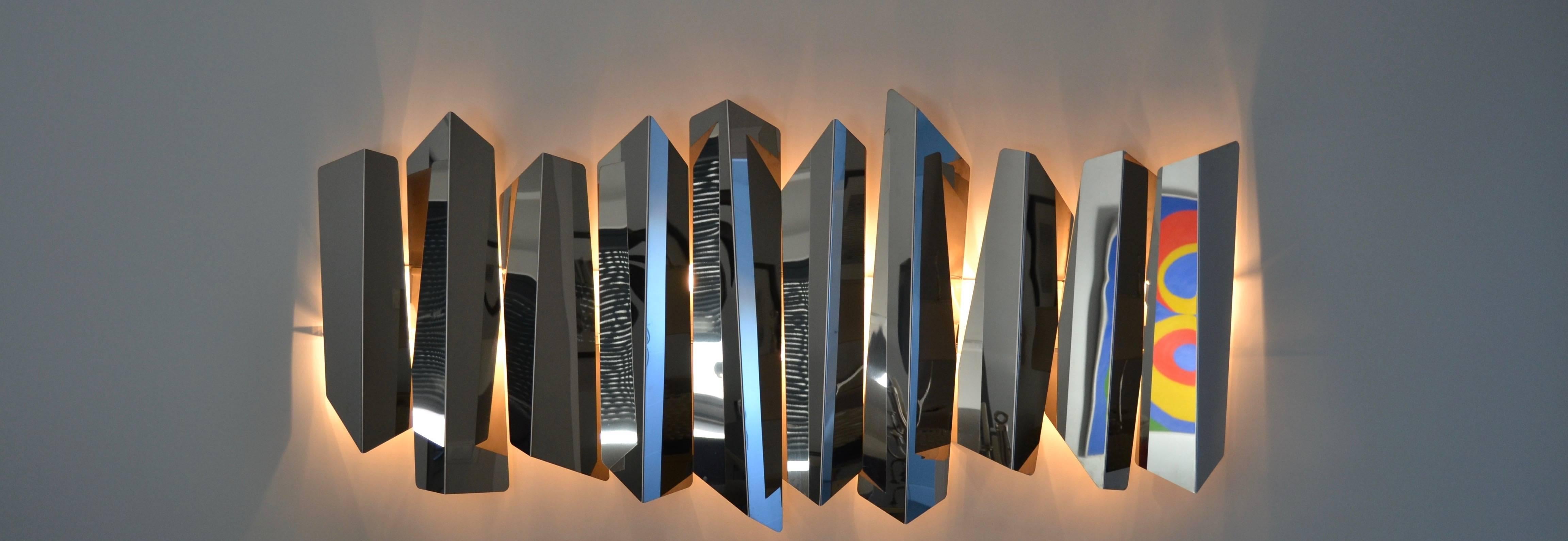 Large wall-mounted chromed steel lighted sculpture by Mario Torregiani, circa 1980-1890.
Wall light has been rewired.
great condition.