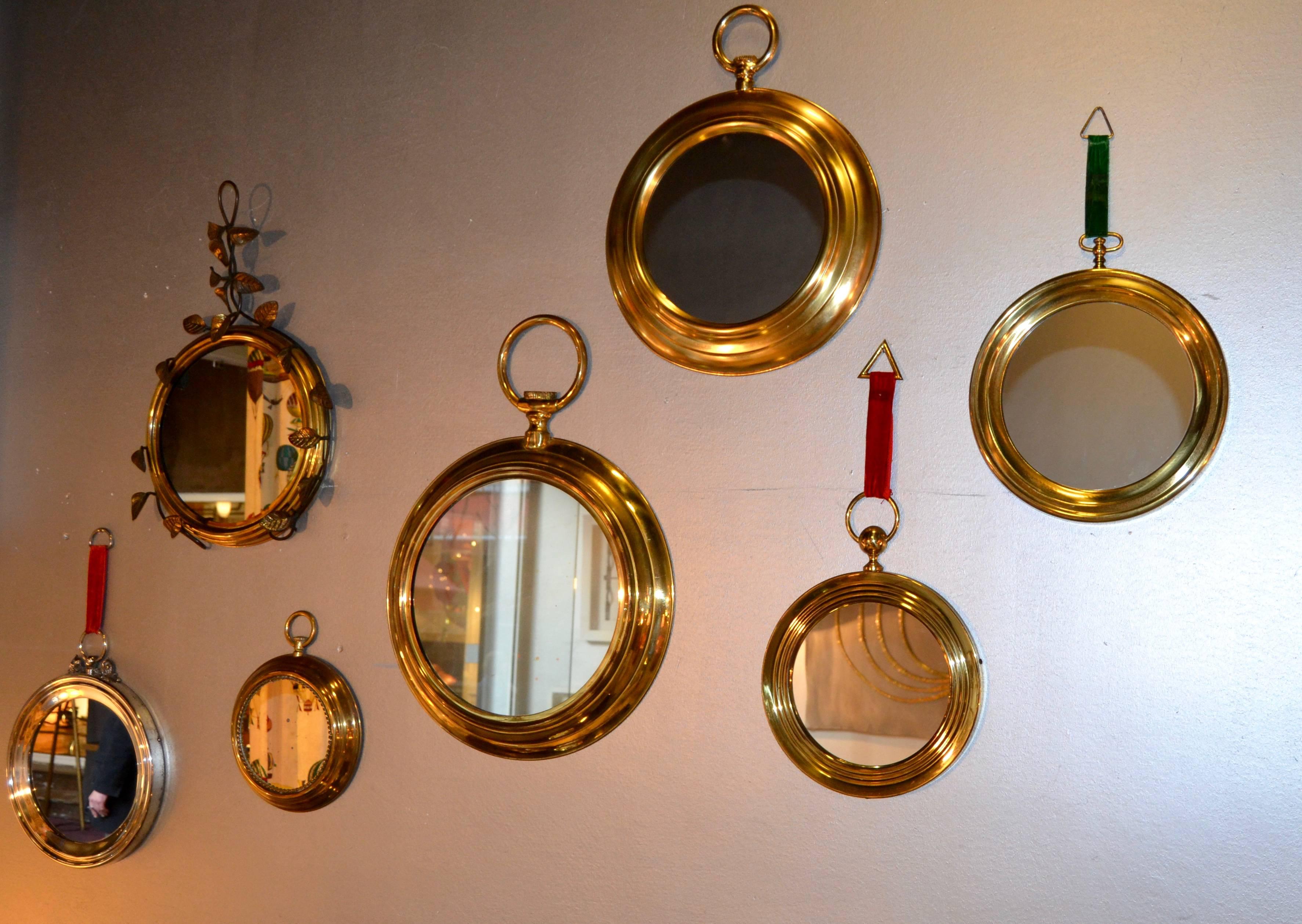Set of 1970s Italian mirrors; six are on brass and one in chrome 
Great vintage condition
Diameter 
 60 cm /23.62 inches for the bigger one 
30 cm /11.81 inches for the smallest one.