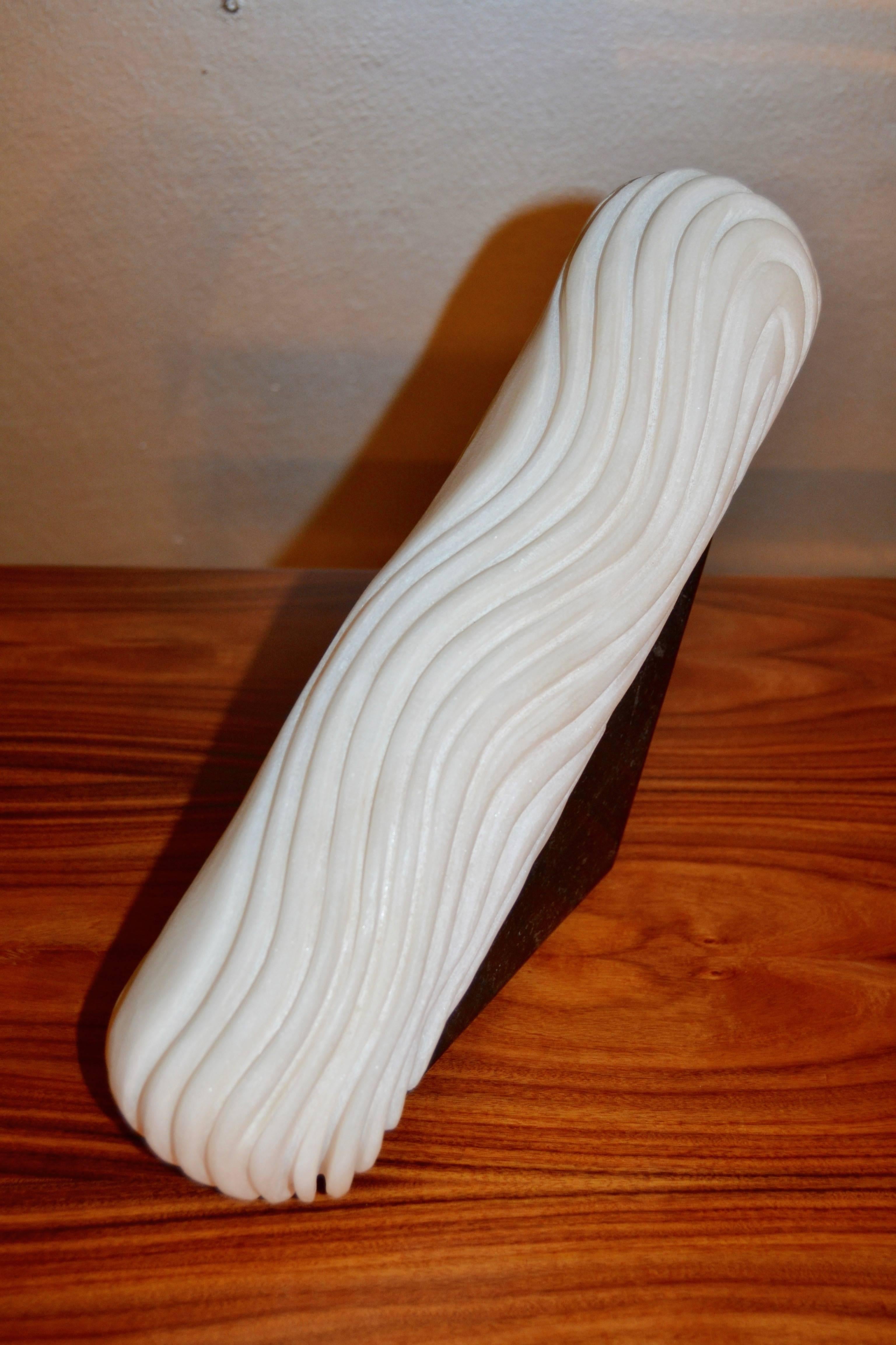 Extremoz creme marble sculpture with black Kilkenny limestone base by the French artist Jean Frederique Bourdier.