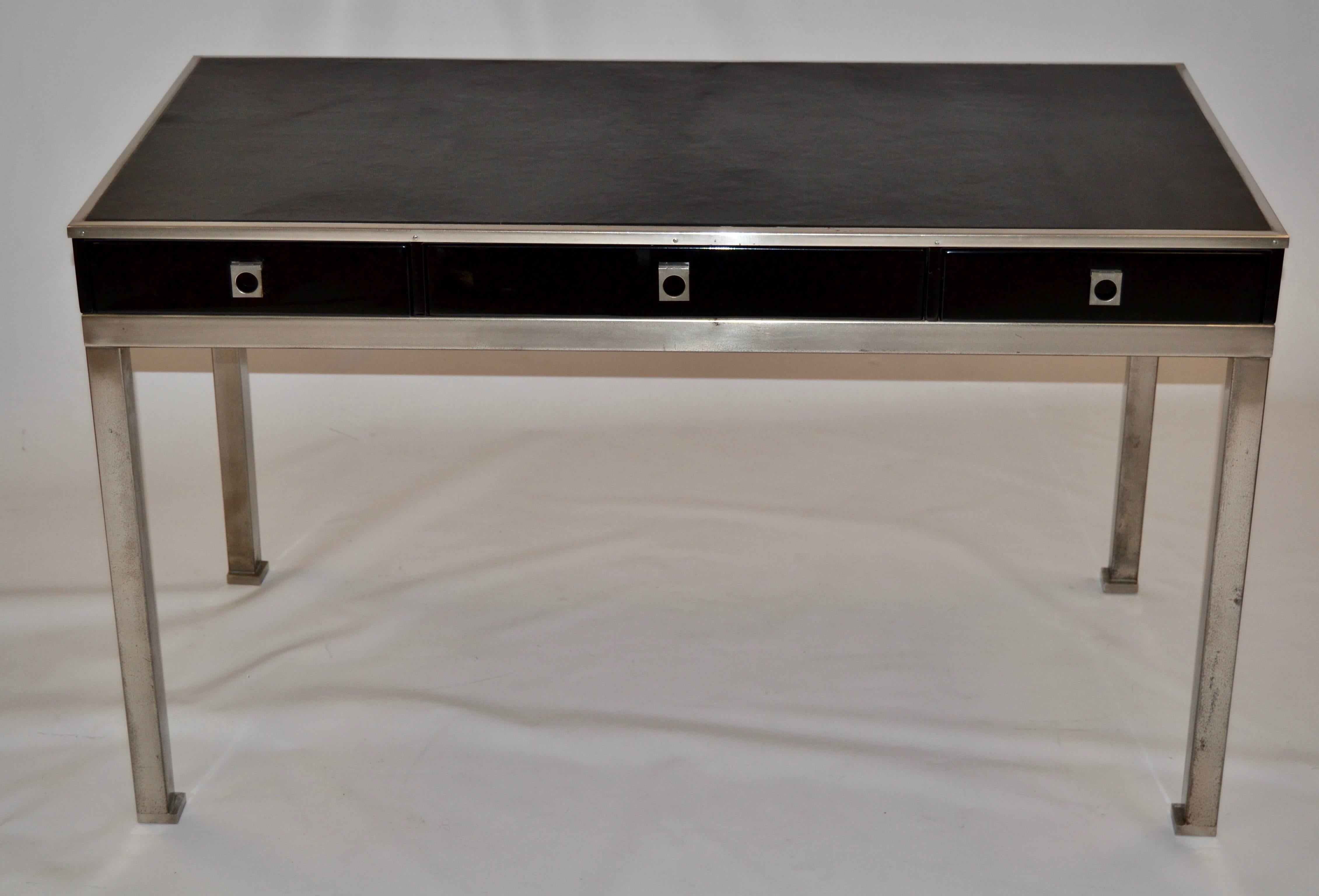 1970s elegant black lacquered and leather top desk by Guy Lefevre for Maison Jansen
Three drawers with rosewood interior.

 