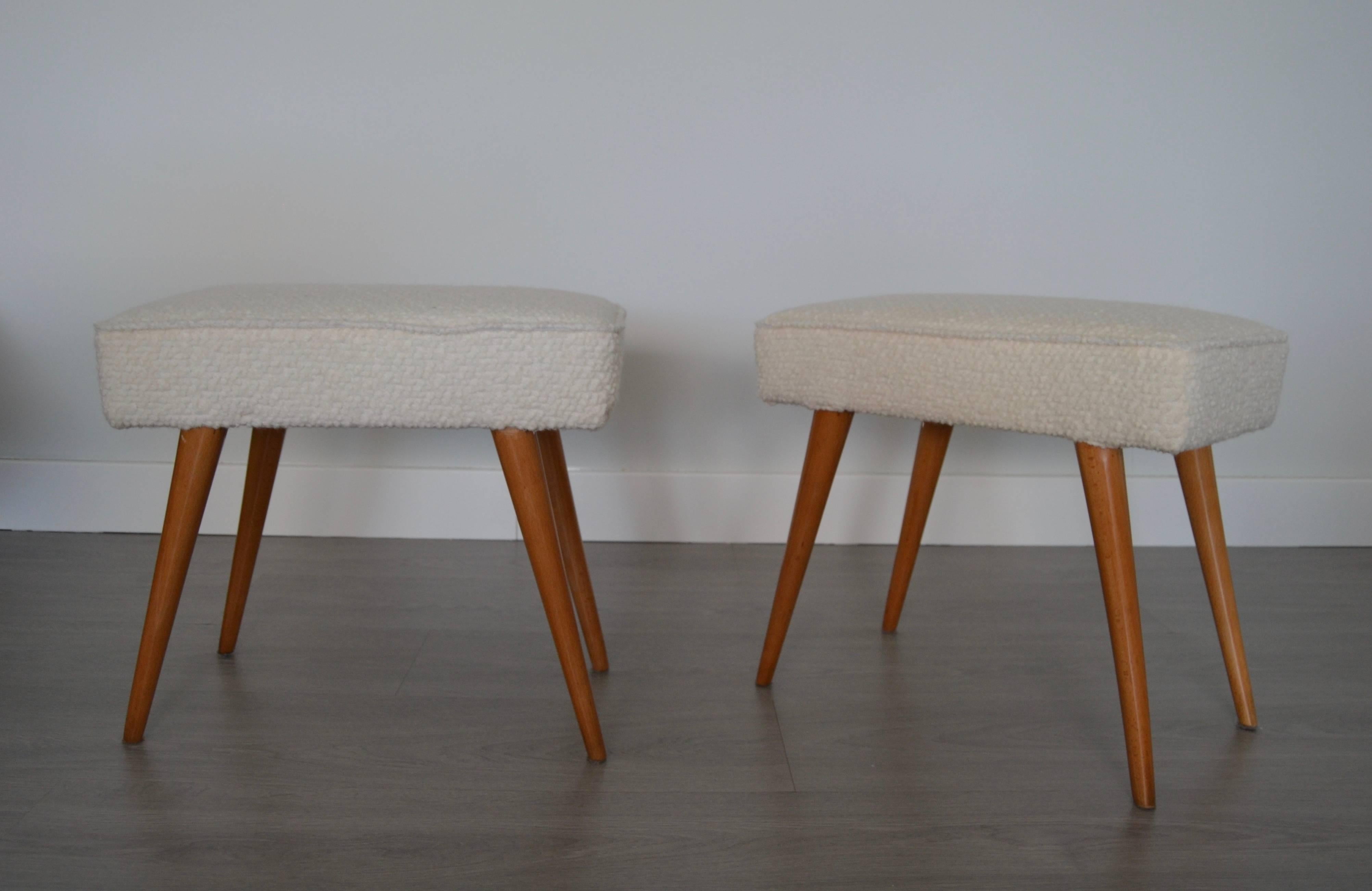 Pair of 1950s with lighted wood conic legs and reupholstered with white wool fabric.