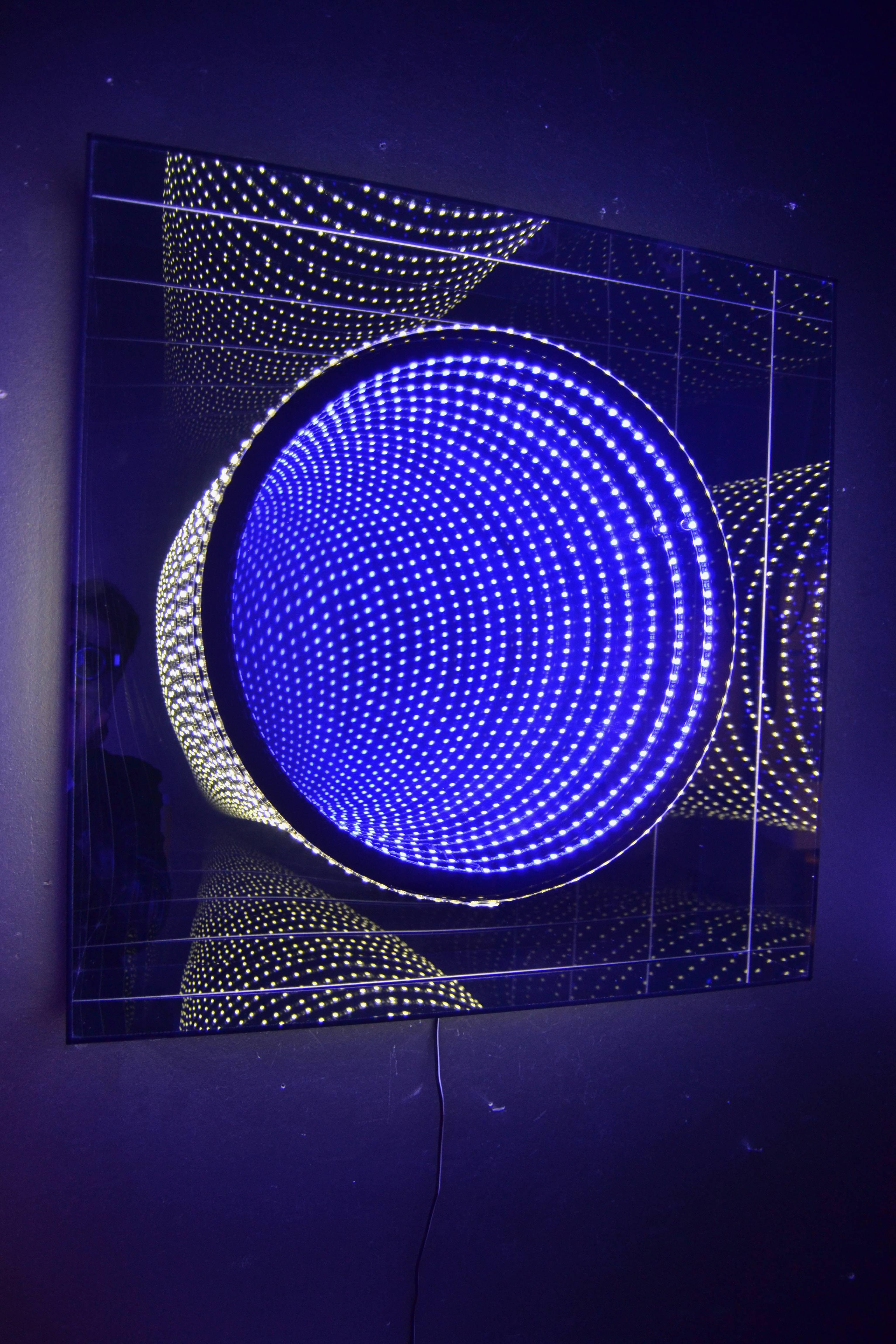 Square infinity mirror in mirrored Lucite box with blue and white light
Created by the French artist Raphael Fenice.
 