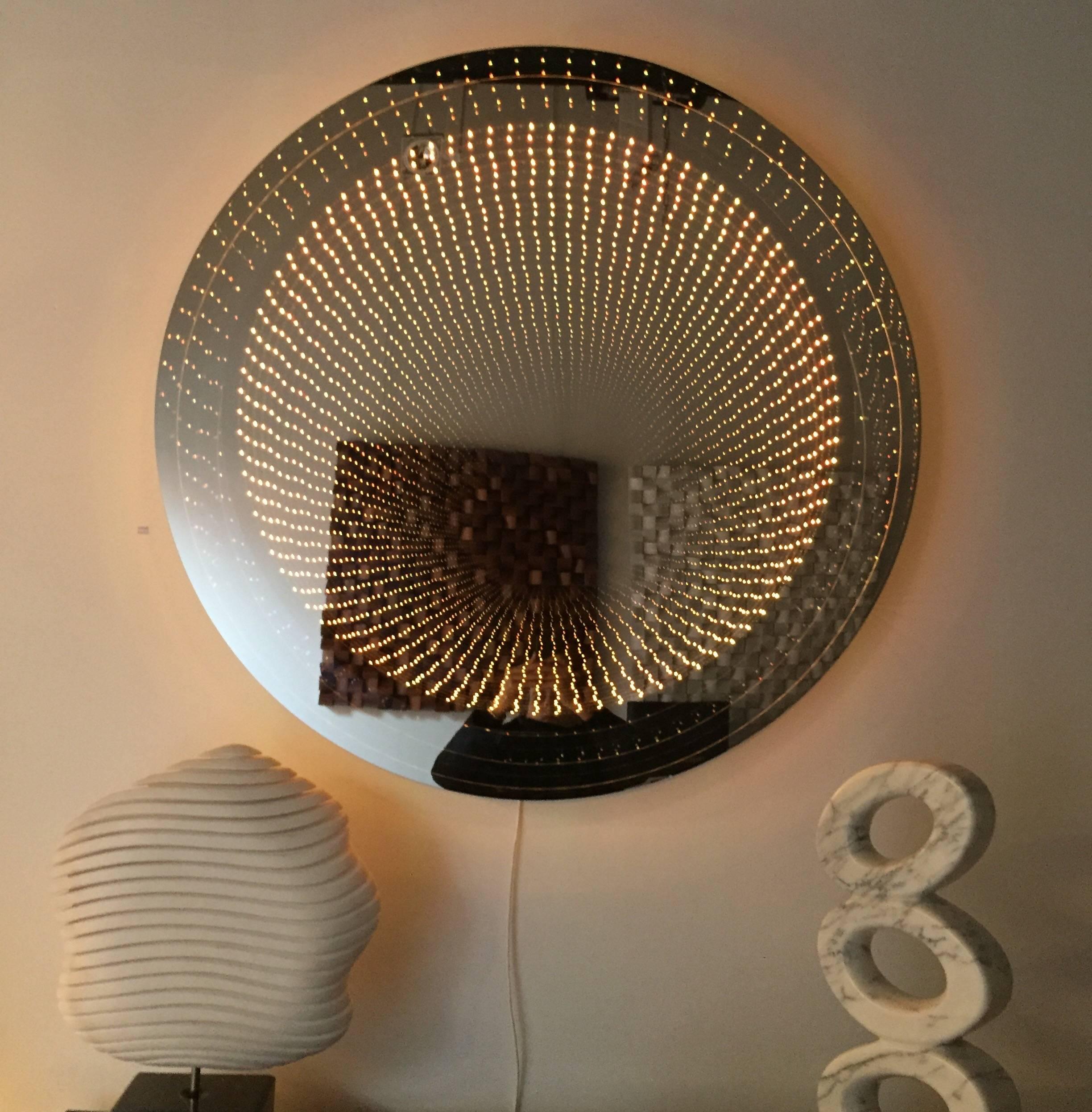 Raphael Fenice infinity mirror in Lucite and led technology
When the mirror is off looks like a real mirror.
Mirror can be controlled by a remote to switch on/off and change color
Wired for European use.
Hand signed on the back by the