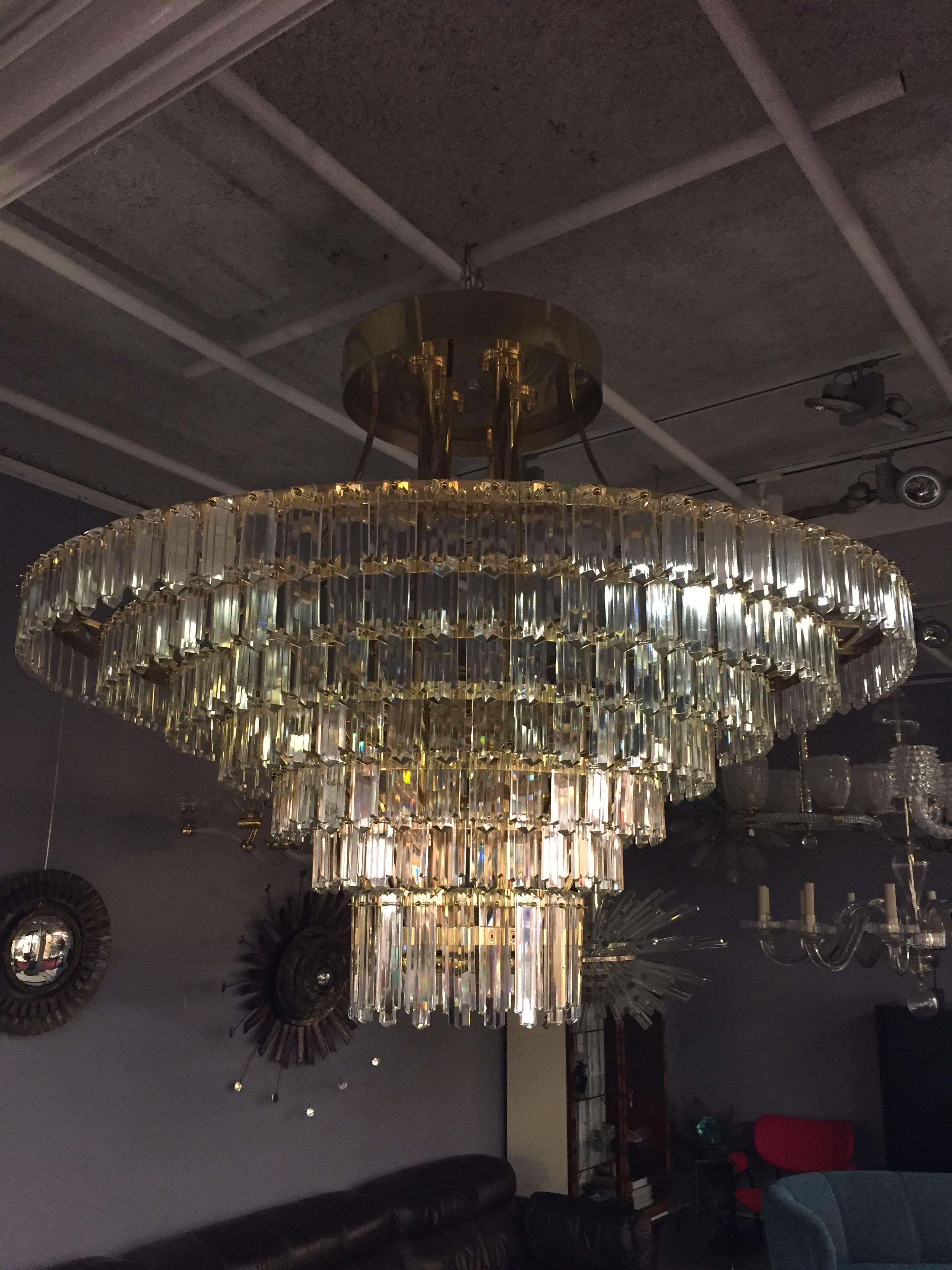 Very impressive and high quality crystal chandelier. Unique and made to measure for a cruise boat in the 1970s. Very high quality of construction, gilt brass and lot of original crystal spare parts, easy to disassemble for shipping. Possibility to