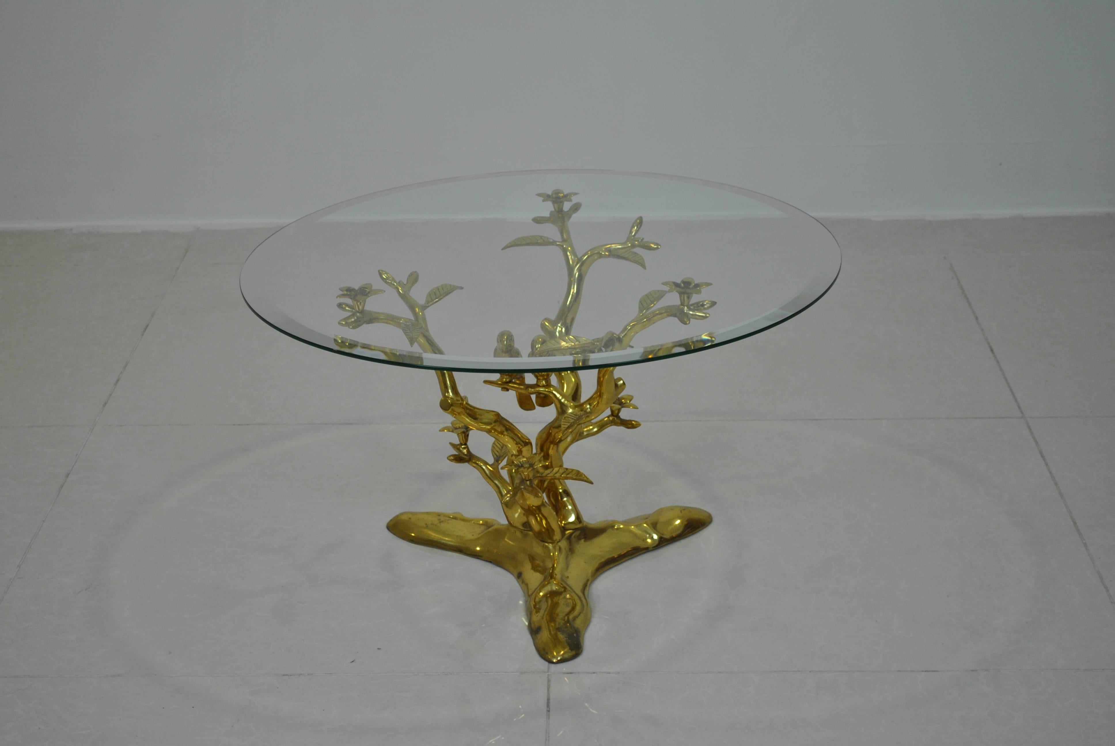 A very nice side or cocktail table in the style of Willy Daro in solid brass with glass top.

Great and known Hollywood Regency pieces that matches perfectly sculptural pieces by Alain Chervet, Jacques Duval-Brasseur, Valenti or