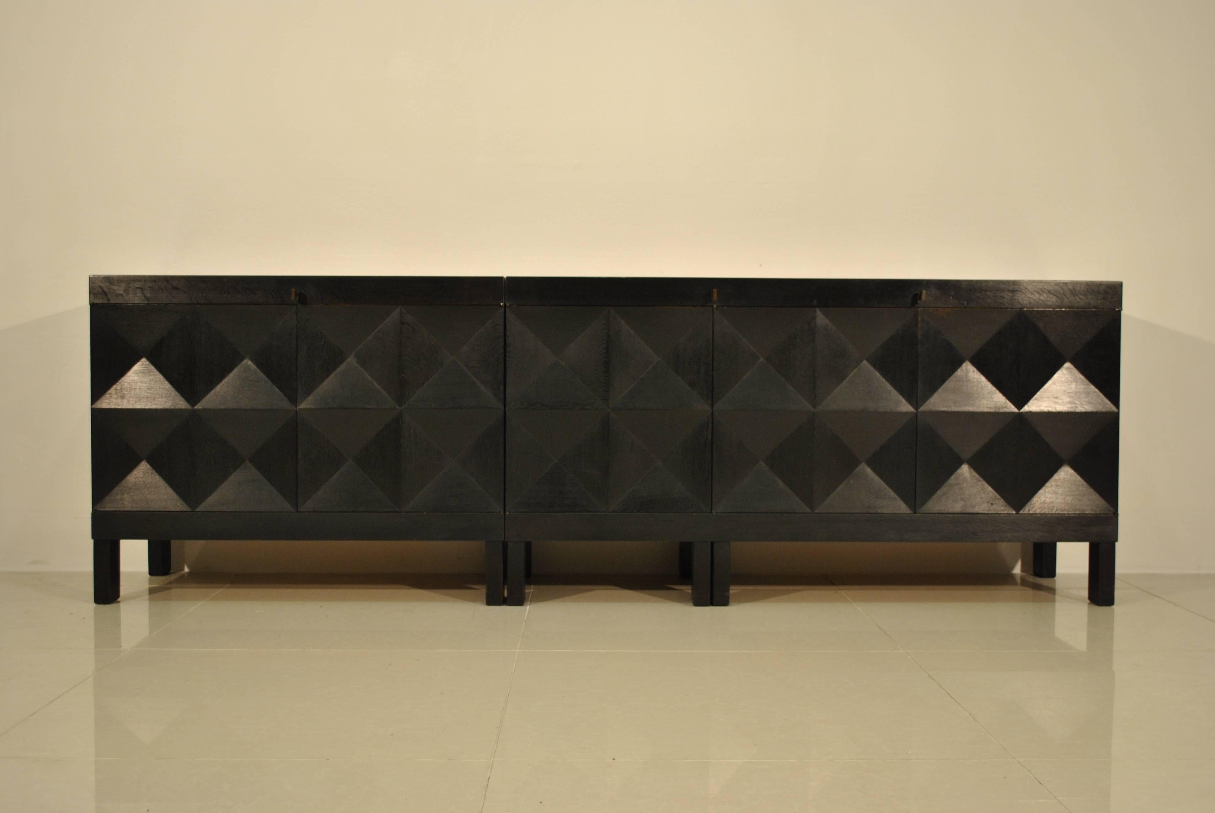 A very nice and rare five doors sideboard by Decoene Frères, Belgium. The sideboard dates from 1964 and is in black stained oak. It is made in two modules (a two doors element and a three doors element, that can eventually be placed