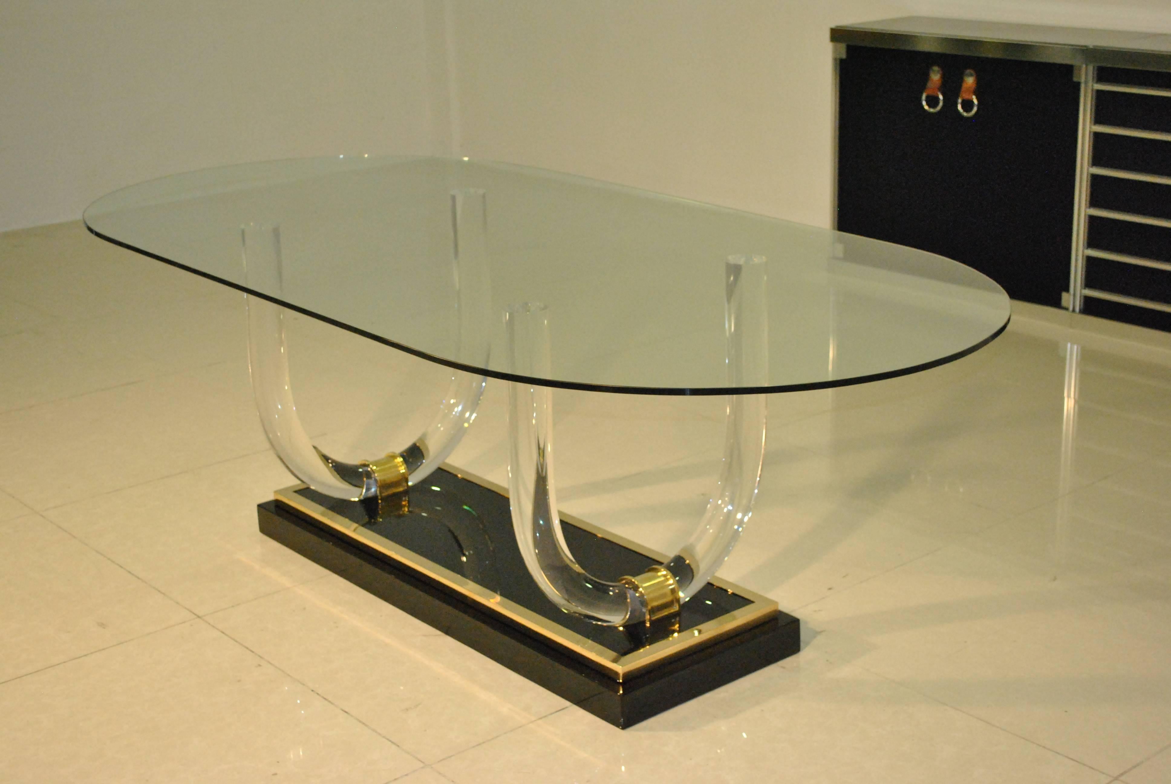A very rare and large Lucite, lacquer and brass dining table by Charles Hollis Jones for reknown house of Romeo Paris. Could look great as a desk or centre table also.
Original glass top, the lacquer and brass base has entirely been refinished by