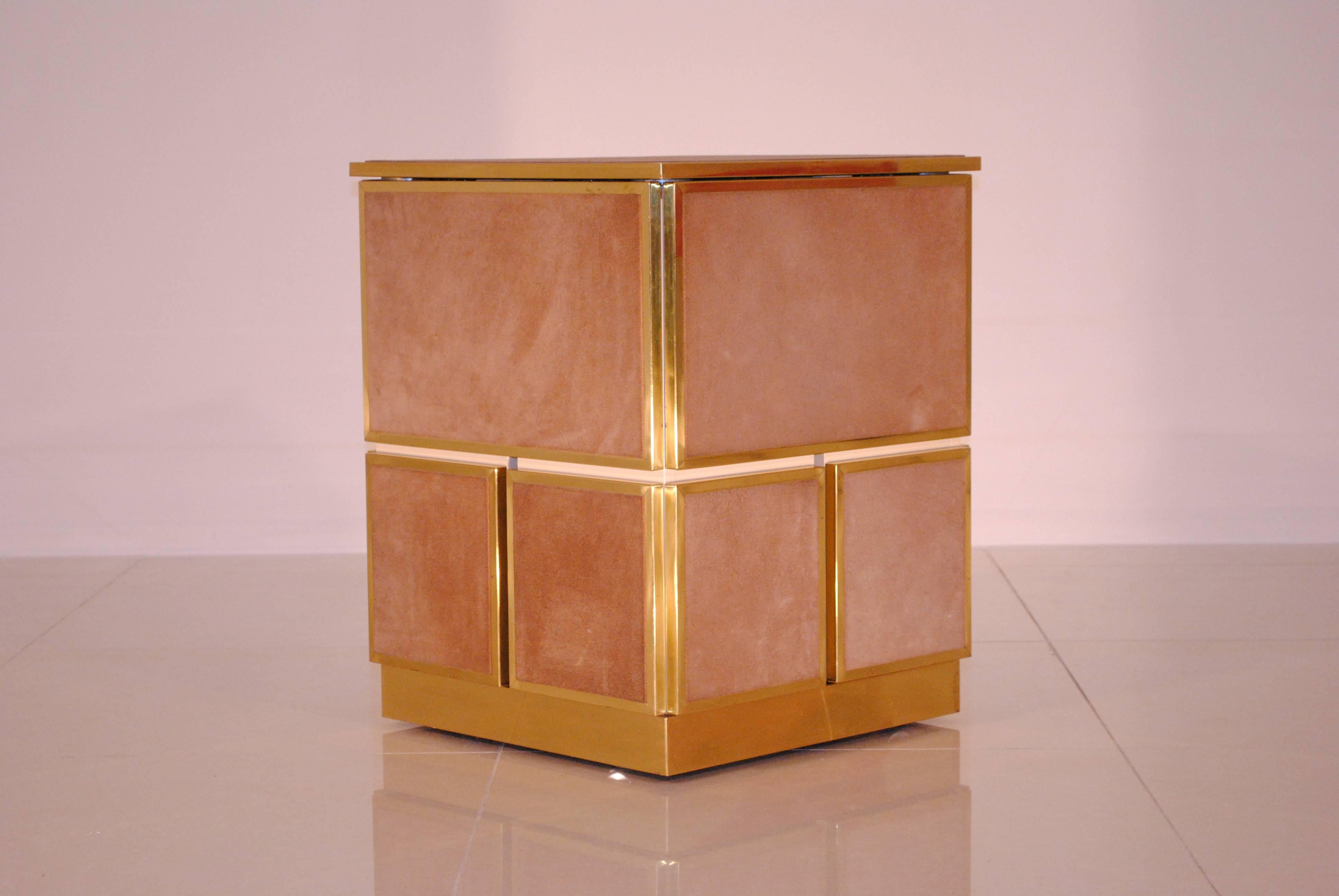 This 'Cubo' folds open and becomes an ingenious games or card table. Design by Renato Meneghetti and made by DDD design, Italy, circa 1976.
High quality materials as lacquered wood, solid brass and sans colors natural Suède.

A great decorative