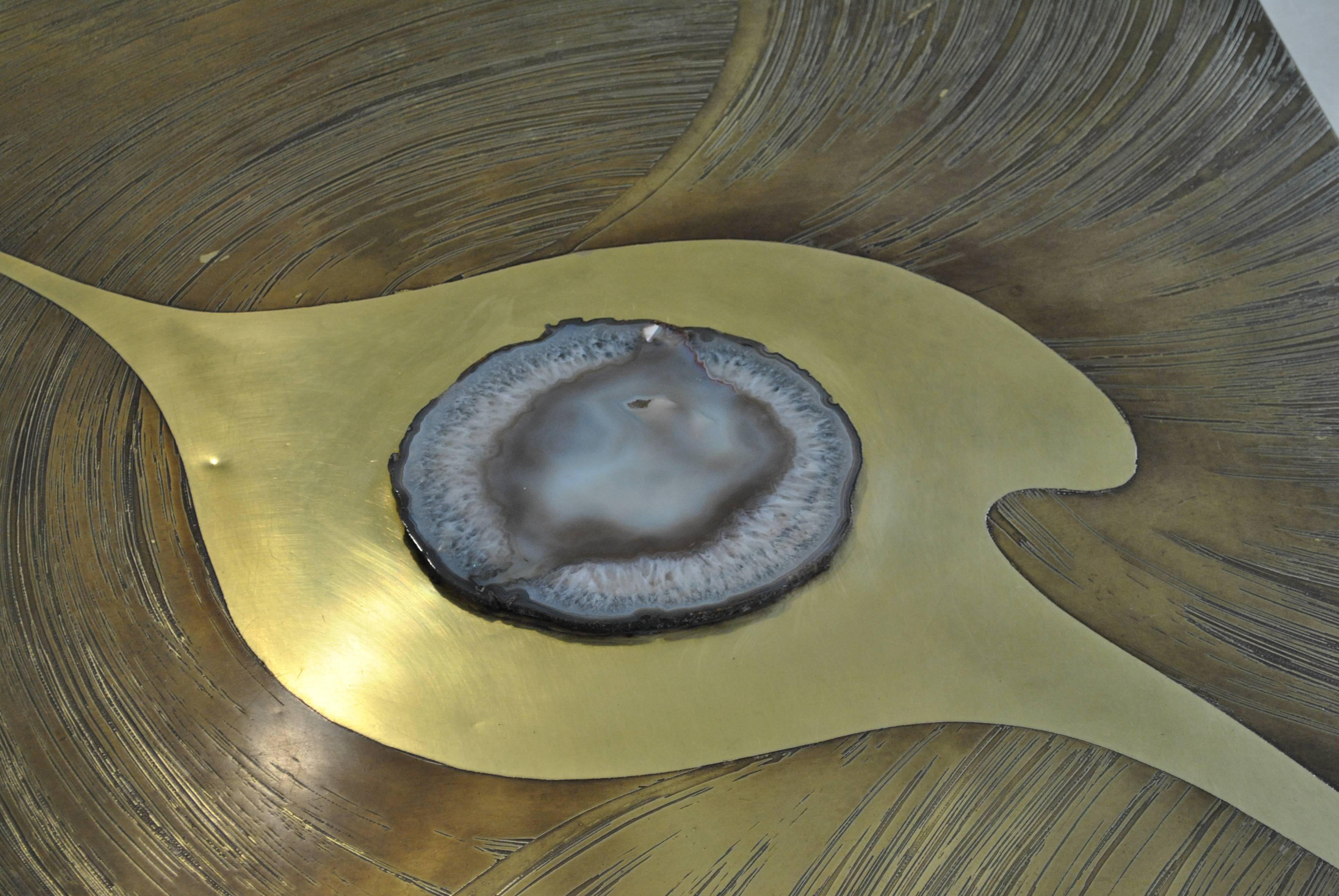 A rare and very nice brass and agate coffee table. Handmade by the artist.
The table is in good vintage condition and is signed.

Great with other Belgian furniture by Ado Chale, Fernand Dresse, Armand Jonckers or Georges Mathias.