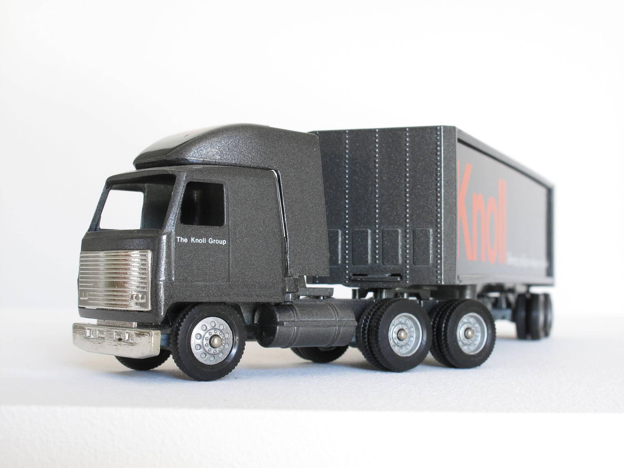 Fun, collectible Knoll Furniture miniature truck advertising, 1:64 scale model, graphite semi-truck with cab and trailer and red logos, made of die cast metal, paint, plastic.
Dimensions: 2 3/8 high x 10 wide x 1 1/2 deep inches.
Condition: Good