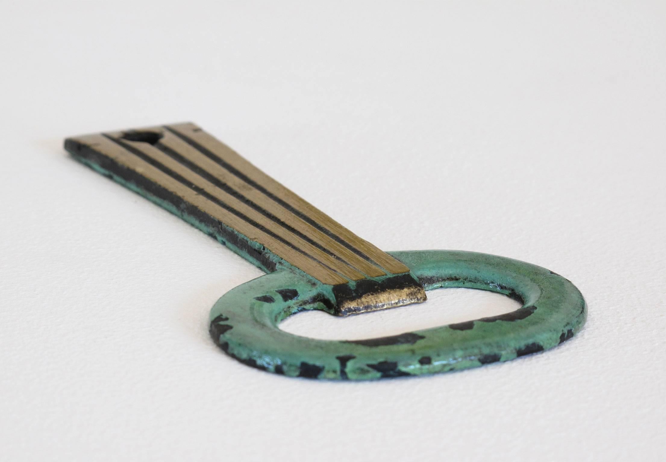 20th Century Solid Brass Key Shaped Bottle Opener with Verdigris Patina For Sale