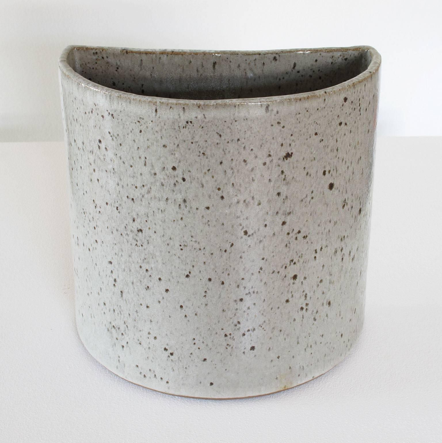 David Cressey 'wall pocket' ceramic planter with flat back to be mounted flush onto wall, stoneware, glazed grey, 1960s, Pro Artisan collection, architectural pottery, Los Angeles, California. Measures: 8 high x 8 wide x 5 deep inches, in excellent