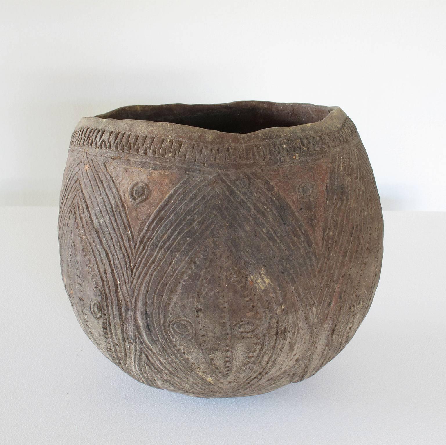 Antique serving vessel, handmade and decorated to be used for yam cult activities, feasts and social ceremonies. Made from 