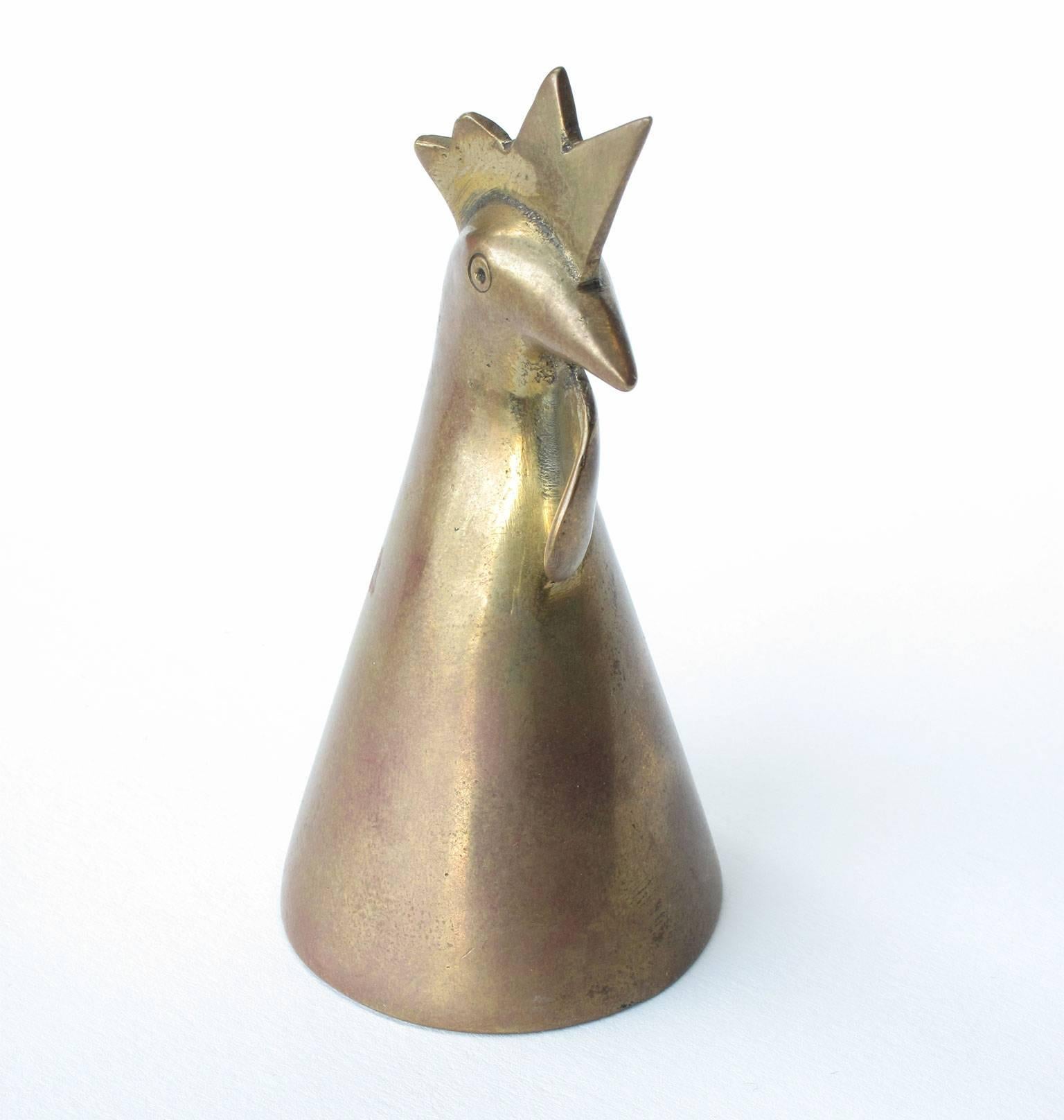 Carl Auböck design object formed in the shape of a rooster, solid brass, signed, Werkstätte Auböck, Austria. Measures: 3 x 1.6 x 1.6 inches.