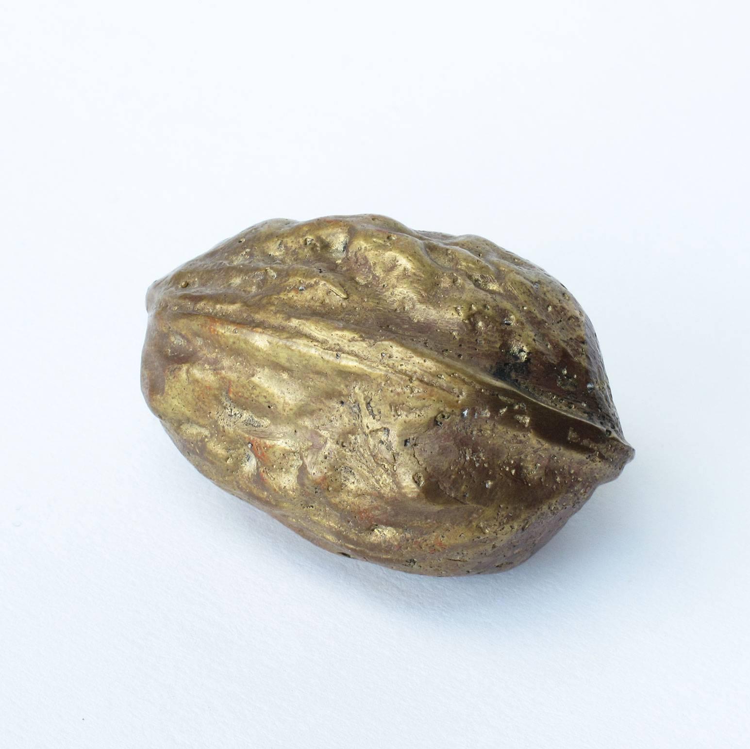 Carl Auböck design object paperweight in the form of a walnut, solid brass, signed, 1950s, Werkstätte Auböck, Austria. Measures: 1 x 1.13 x 1.75 inches.