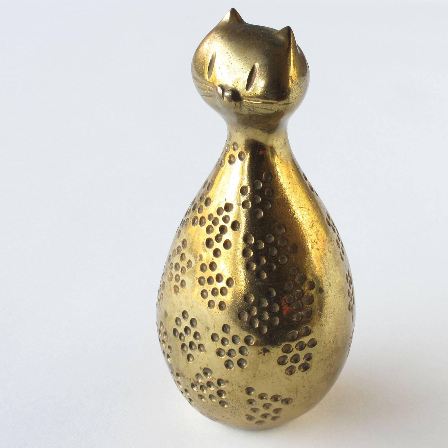 Ben Seibel coin bank, brass-plated cast metal with rubber stop, 1950s. Measures: 6.75 high x 3.25 wide x 3 deep inches, Jenfred Ware, New York.