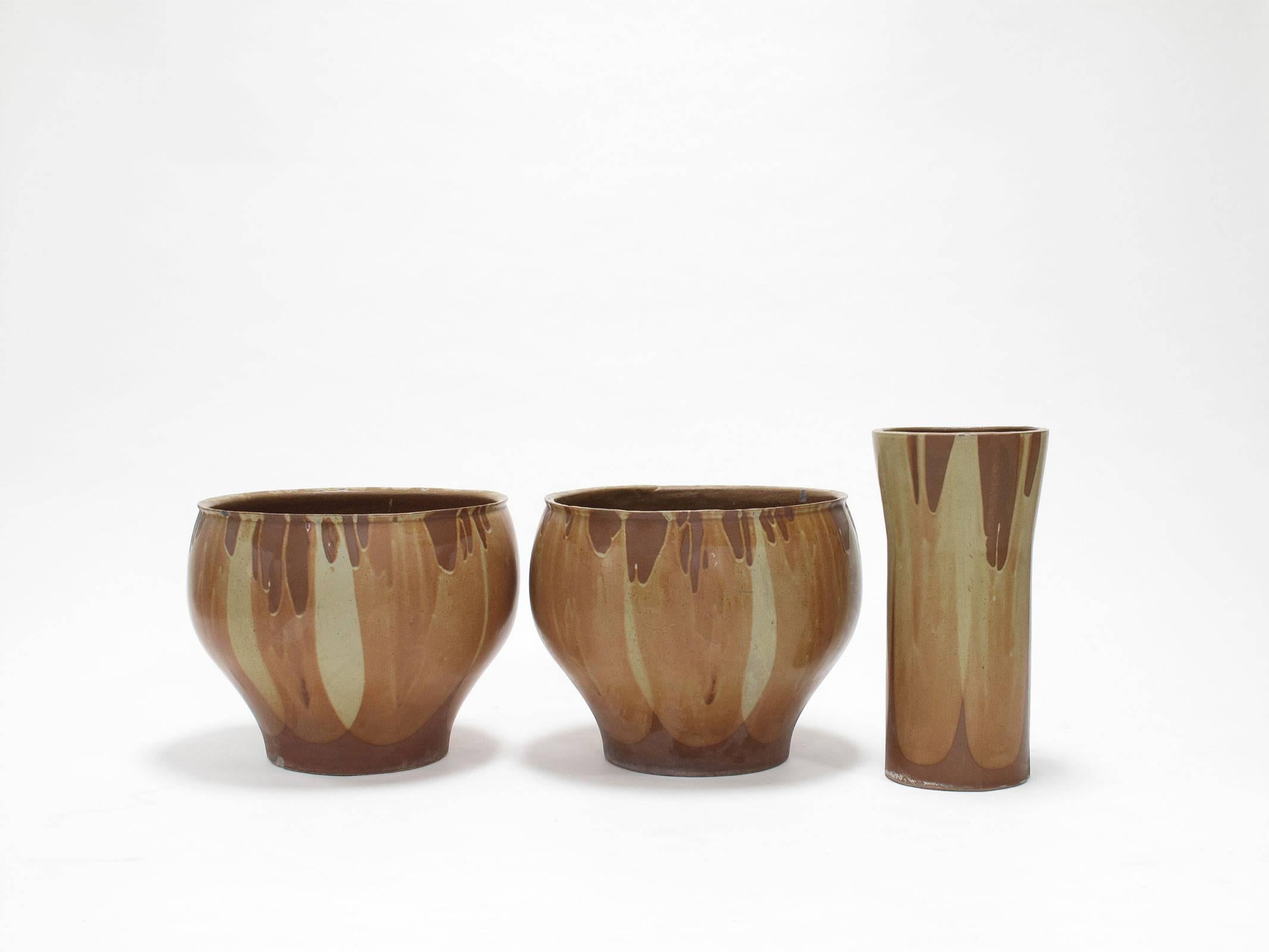 Collection of three David Cressey 'flame' design ceramic vessels, stoneware, glazed golden ochre and sienna yellow, 1960s, Pro Artisan collection, Architectural Pottery, Los Angeles, California, two measuring 15.75 high x 19.75 diameter inches and