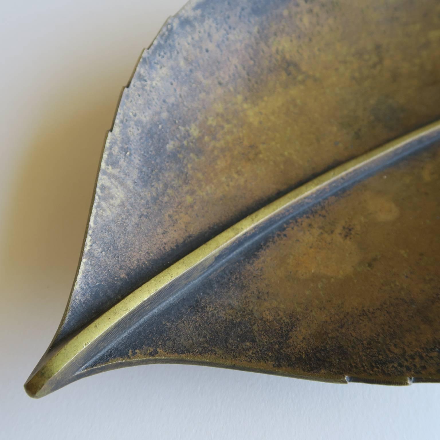 Exceptional solid brass object as a decorative dish or tray, sculpted in the form of a leaf, designed by Carl Auböck and made at the Werkstatte Auböck in Austria, 1930s, signed with impressed 'Auböck MADE IN AUSTRIA' mark. Measures: 1.5 high x