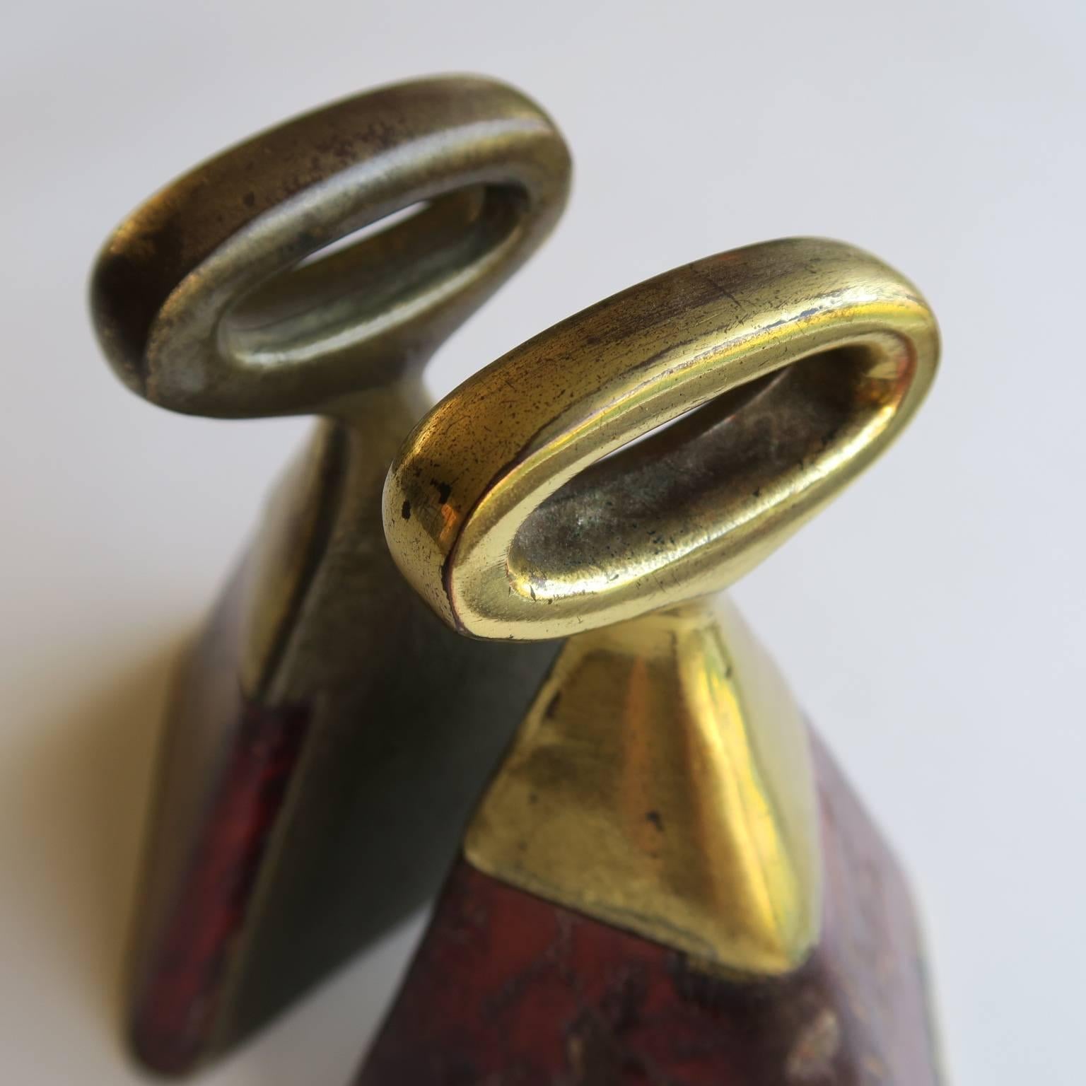 Sunburned and charred, these Ben Seibel bookends look like they were strapped to a horse and ridden for years, the patina on the leather is so special, wrapped in the original leather and warm patinated brass plated cast metal, measure: 5 7/8 high x