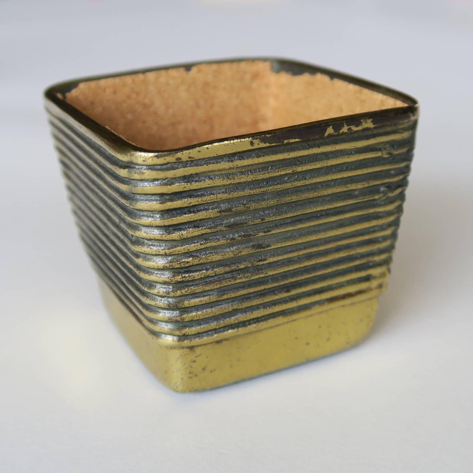Ben Seibel cup, brass-plated cast metal, cork lined interior, 1950s. Measures: 2 3/8 high x 2 1/8 x 2 1/8 inches.