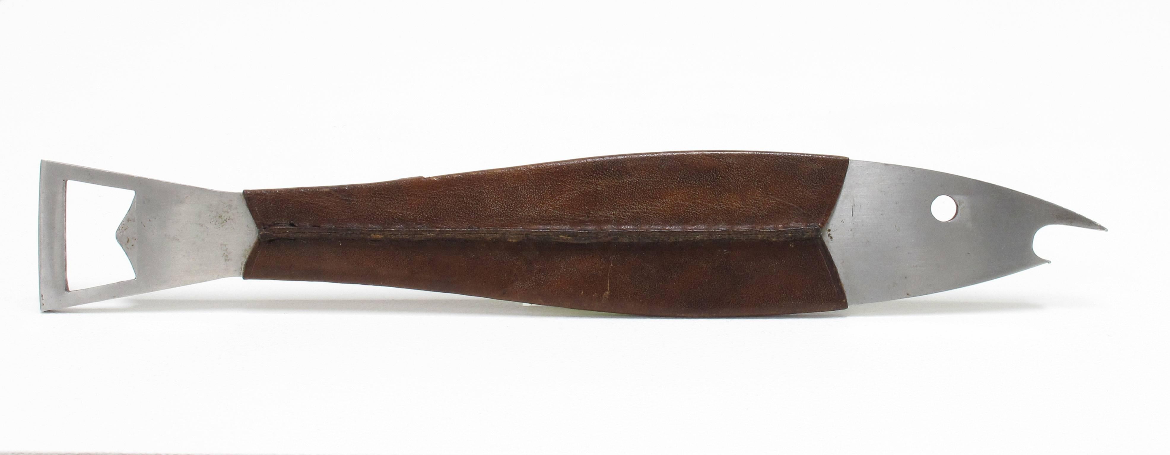 Carl Auböck
'Neptune', 1950s
Bottle opener, fish shaped bar tool
Stainless steel, hand-stitched leather
Modernist, Austria, Werkstätte Auböck

Measurements in inches:1.38 high x 9.5 wide x 0.13 deep