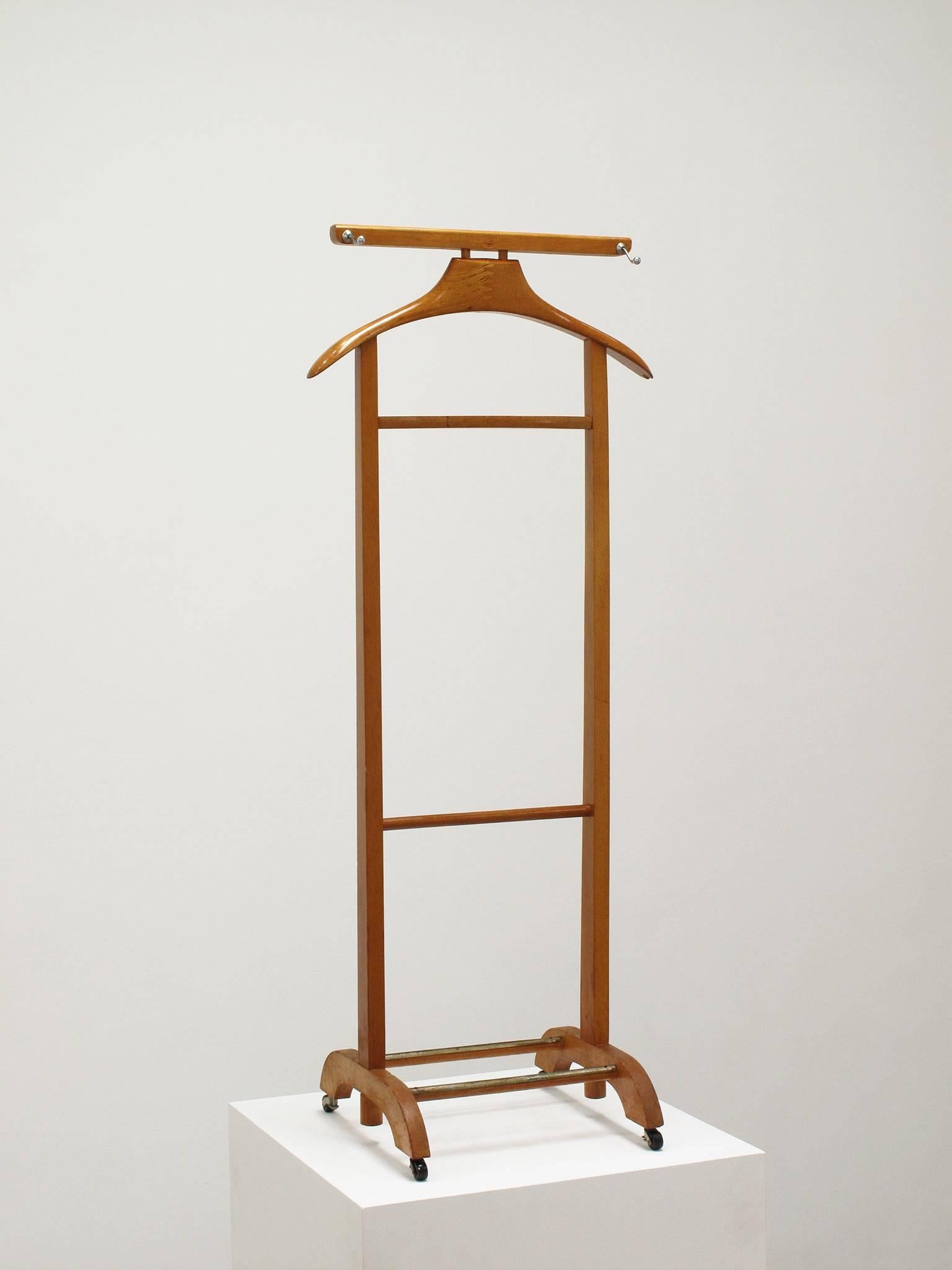 Fratelli Reguitti.
Valet apparel stand, wood, Italy, 1960s.
Measurements in inches:
43.5 high x 17.75 wide x 13.75 deep.