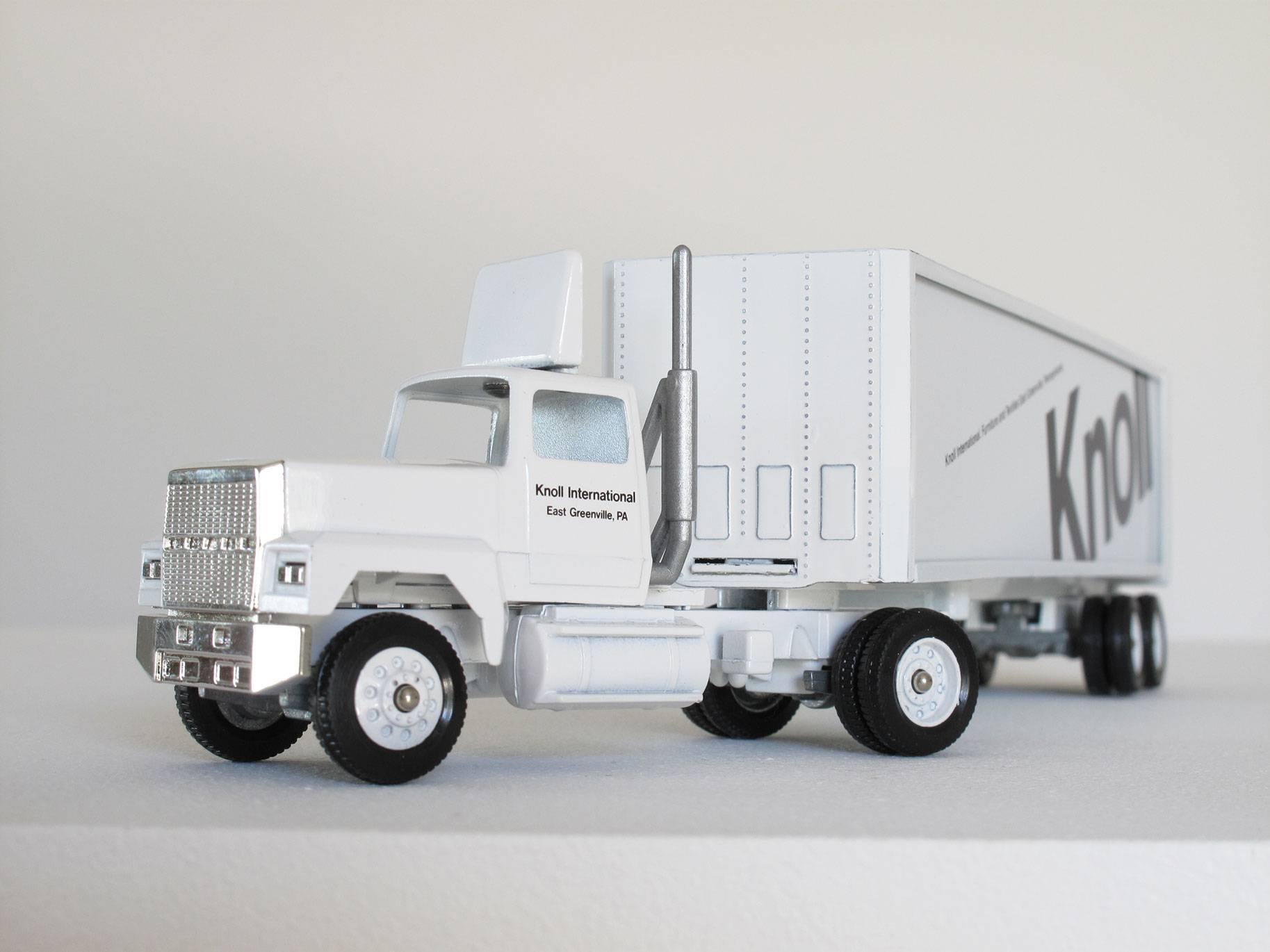 Fun, collectible Knoll Furniture miniature truck advertising, 1:64 scale model, white semi truck with cab and trailer and black logos, made of die cast metal, paint, plastic.
Dimensions: 2 3/8 high x 9 3/4 wide x 1 1/2 deep inches.
Condition: Good